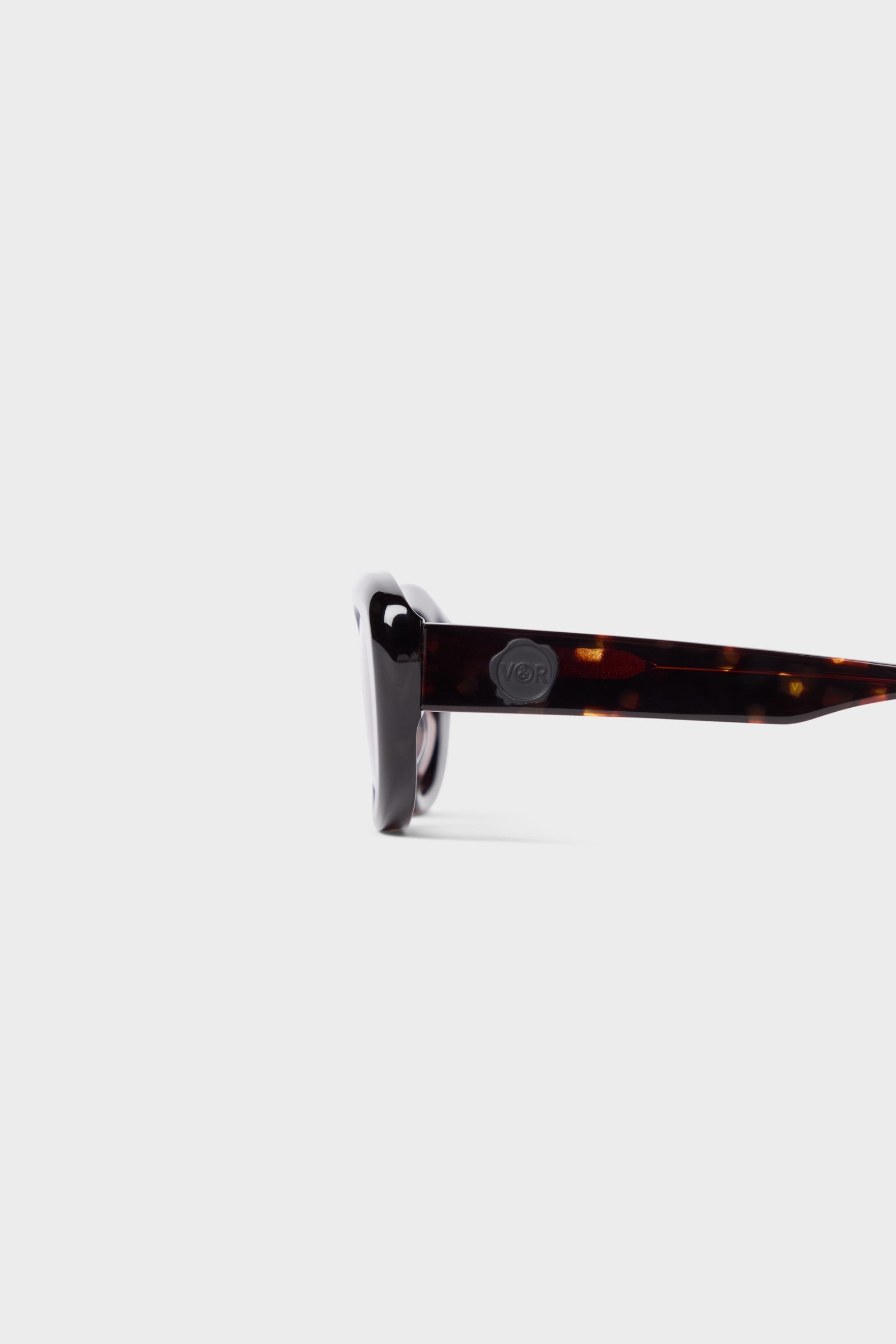 Close up on tortoise oval sunglasses.