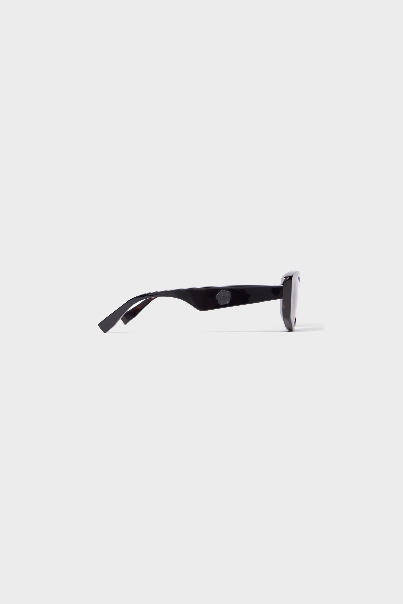 Semi-oval black sunglasses on a white background.