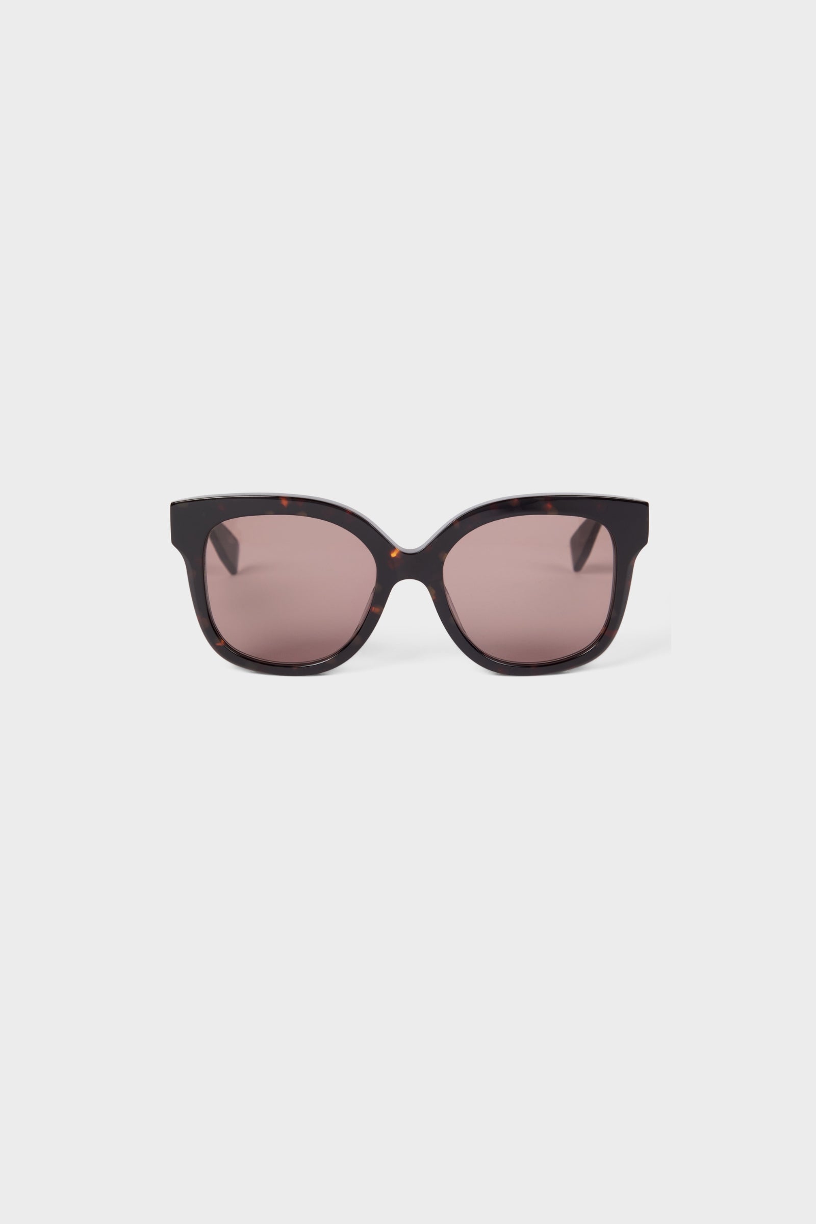 Sleek tortoiseshell sunglasses with oversized frames and gradient brown lenses, perfect for a chic and stylish look.