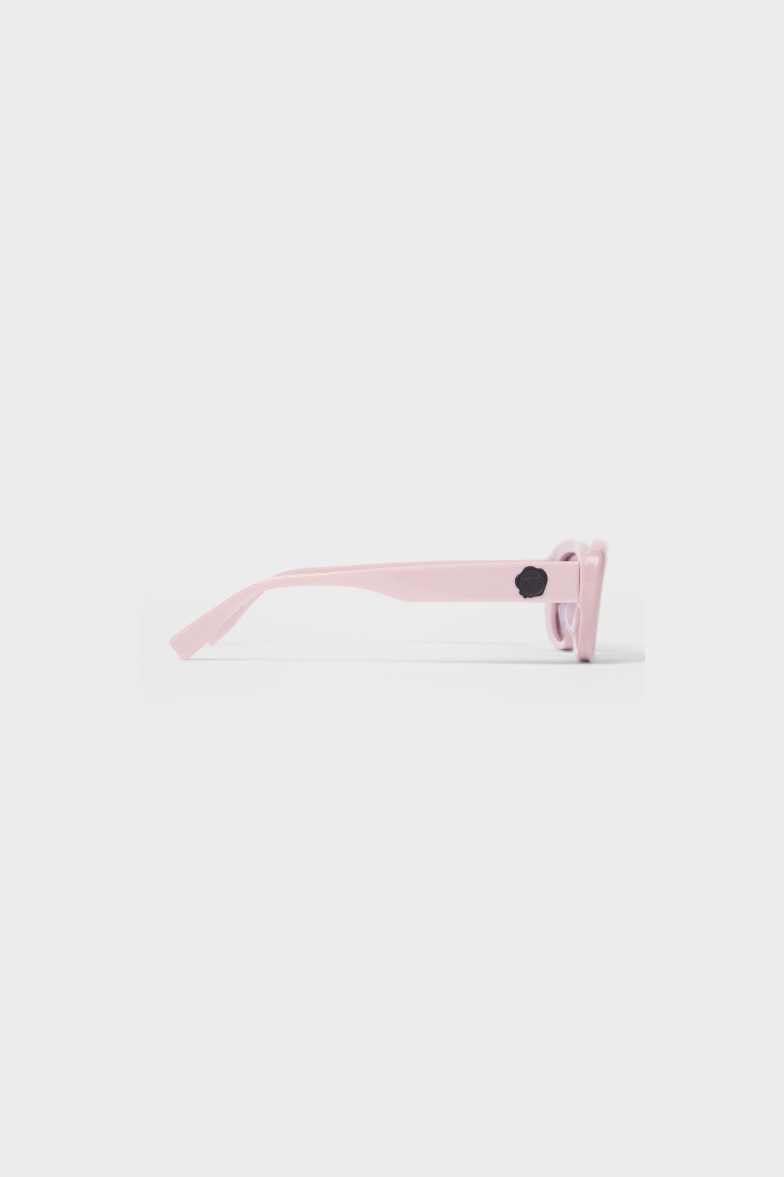 Light pink sunglasses on a white background.