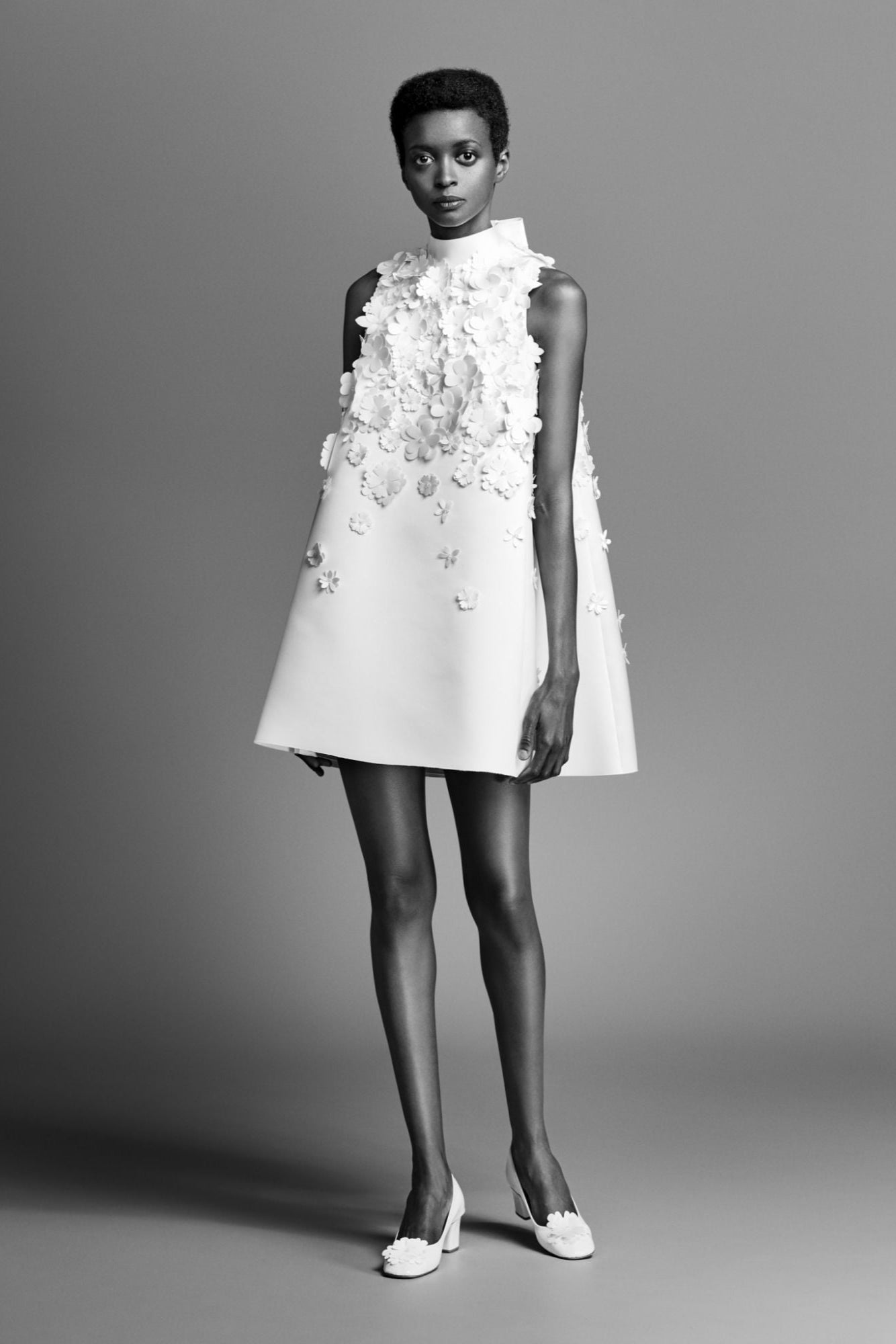 Flirty and voluminous 60s couture-inspired mini dress with 3d flower applique detailing