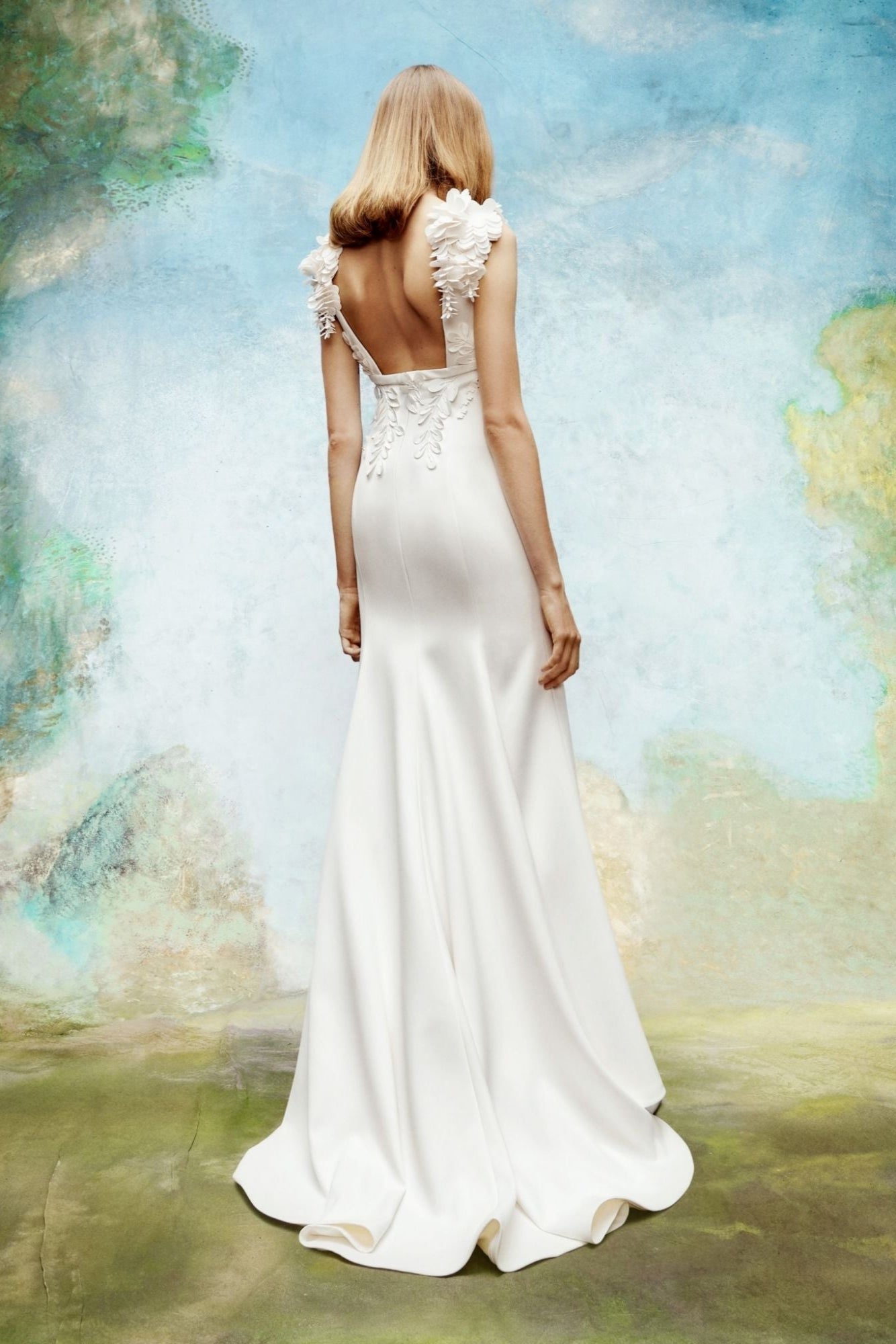 Crepe mermaid silhouette dress with boat neckline features a square open back