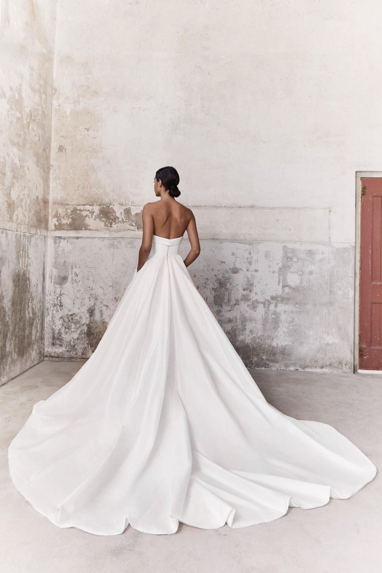 Viktor & Rolf Mariage Bridalwear Collection Taffeta Volant Dream gown, elegant design in white with flowing train.