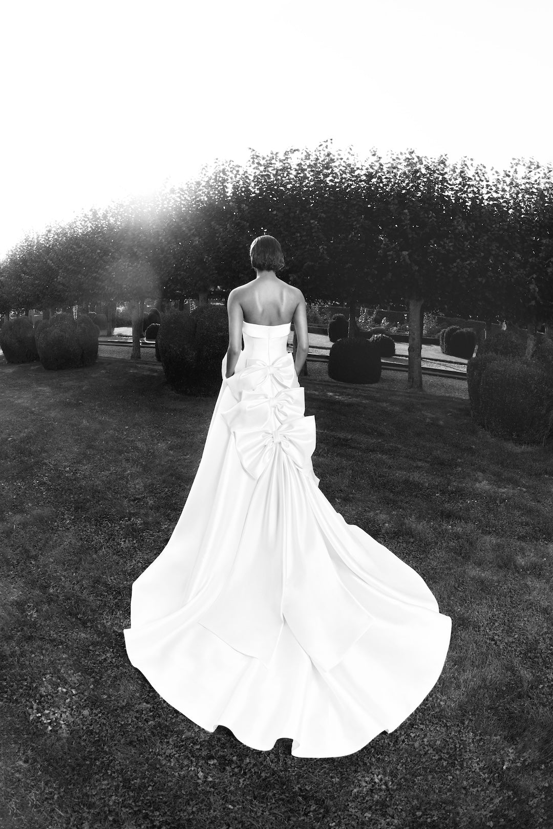 Viktor & Rolf Mariage Bridalwear Collection, elegant Flowerbomb ribbon a-line gown with sculptural bow detailing.