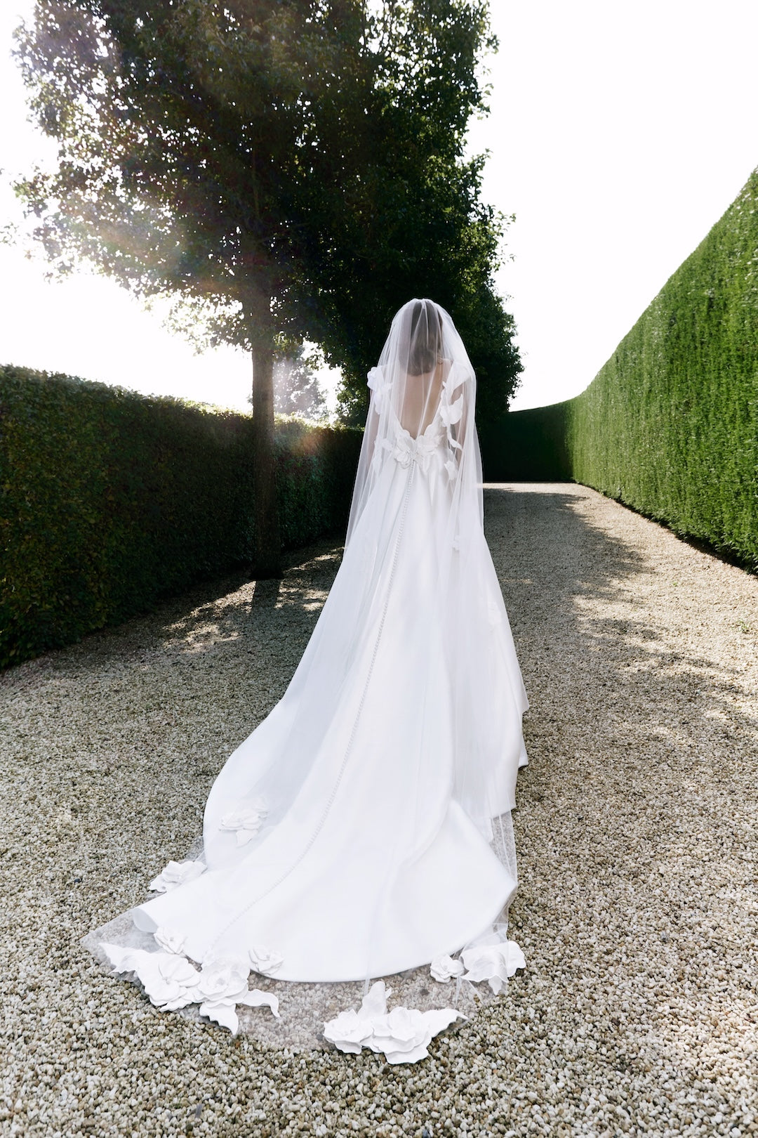 Viktor & Rolf Mariage Bridalwear Collection, Intricate florals gown, elegant design with ethereal veil and floral details.
