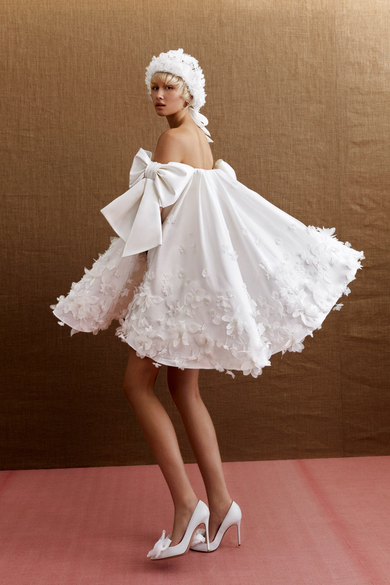 60’s inspired cape covered in an airy organza mountain flower fur with sparkling crystals, from the Viktor&Rolf Mariage collection.