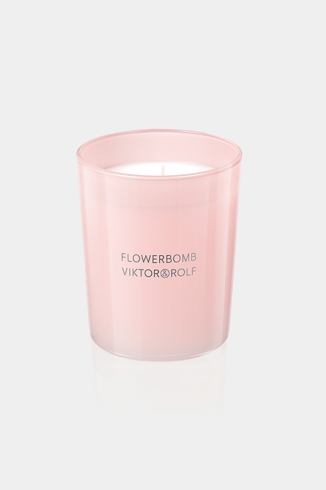 Viktor&Rolf pink Flowerbomb candle on a white background.