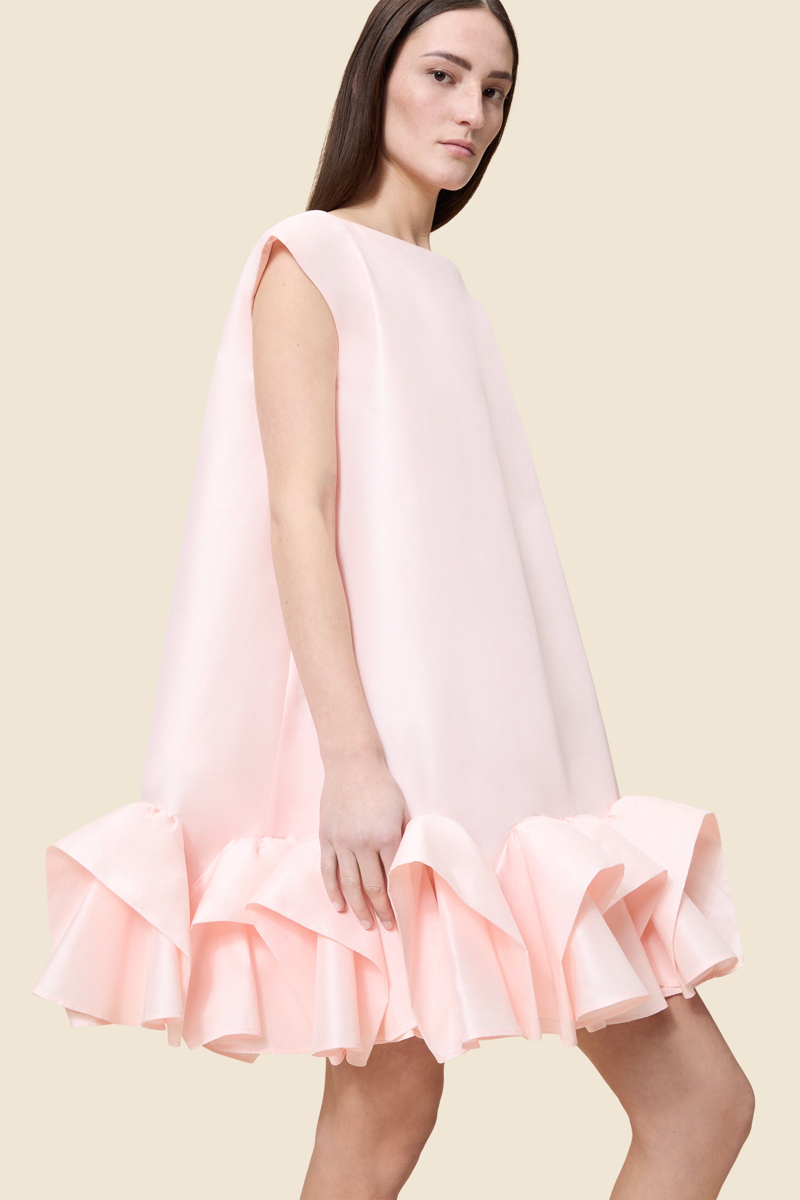 The craftmanship of the dress reinterprets classic haute couture tuck ups into a modern silhouette from silk-blend taffeta