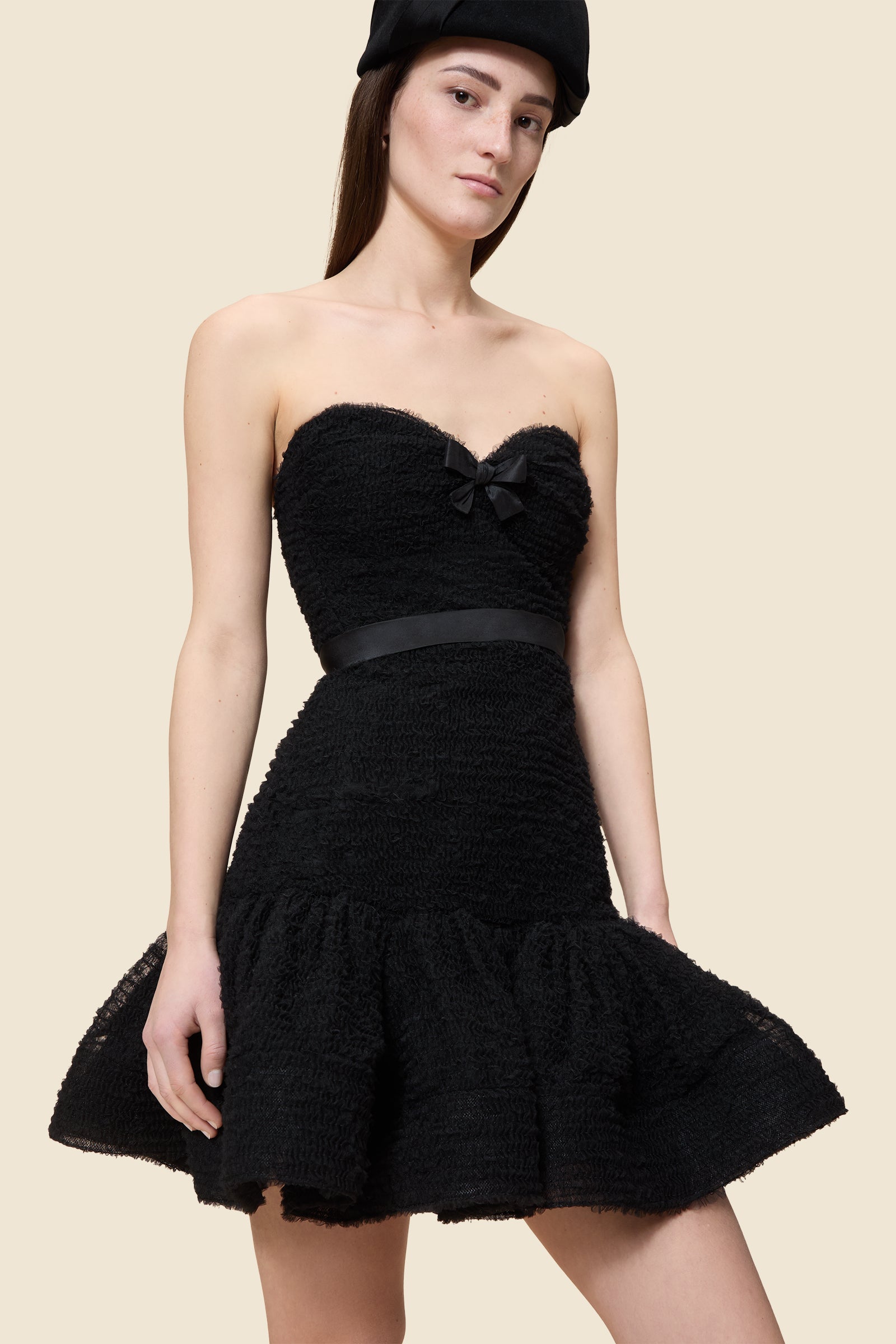 Inspired by the tulle from the ‘late stage capitalism waltz’ haute couture collection, the dress features hand crafted tulle ruffles for a feminine texture