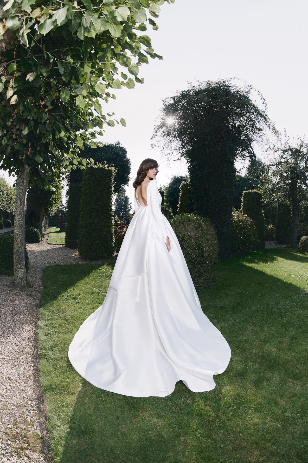 Viktor & Rolf Mariage Bridalwear Collection elegant gown, graceful long-sleeve design, part of Autumn Winter 25 Collection.