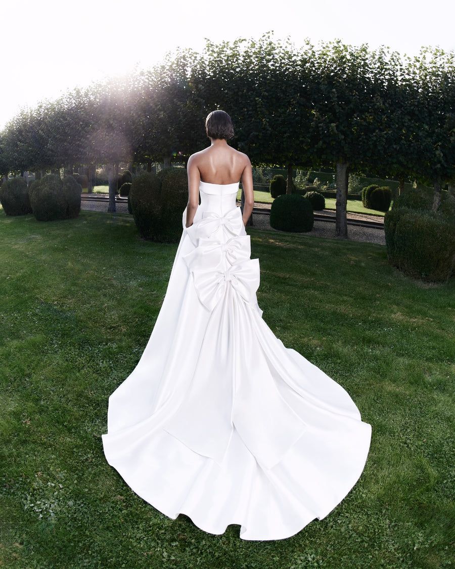 Viktor & Rolf Mariage Bridalwear Collection gown with elegant bow detail from Autumn Winter 25 Collection, luxurious design.