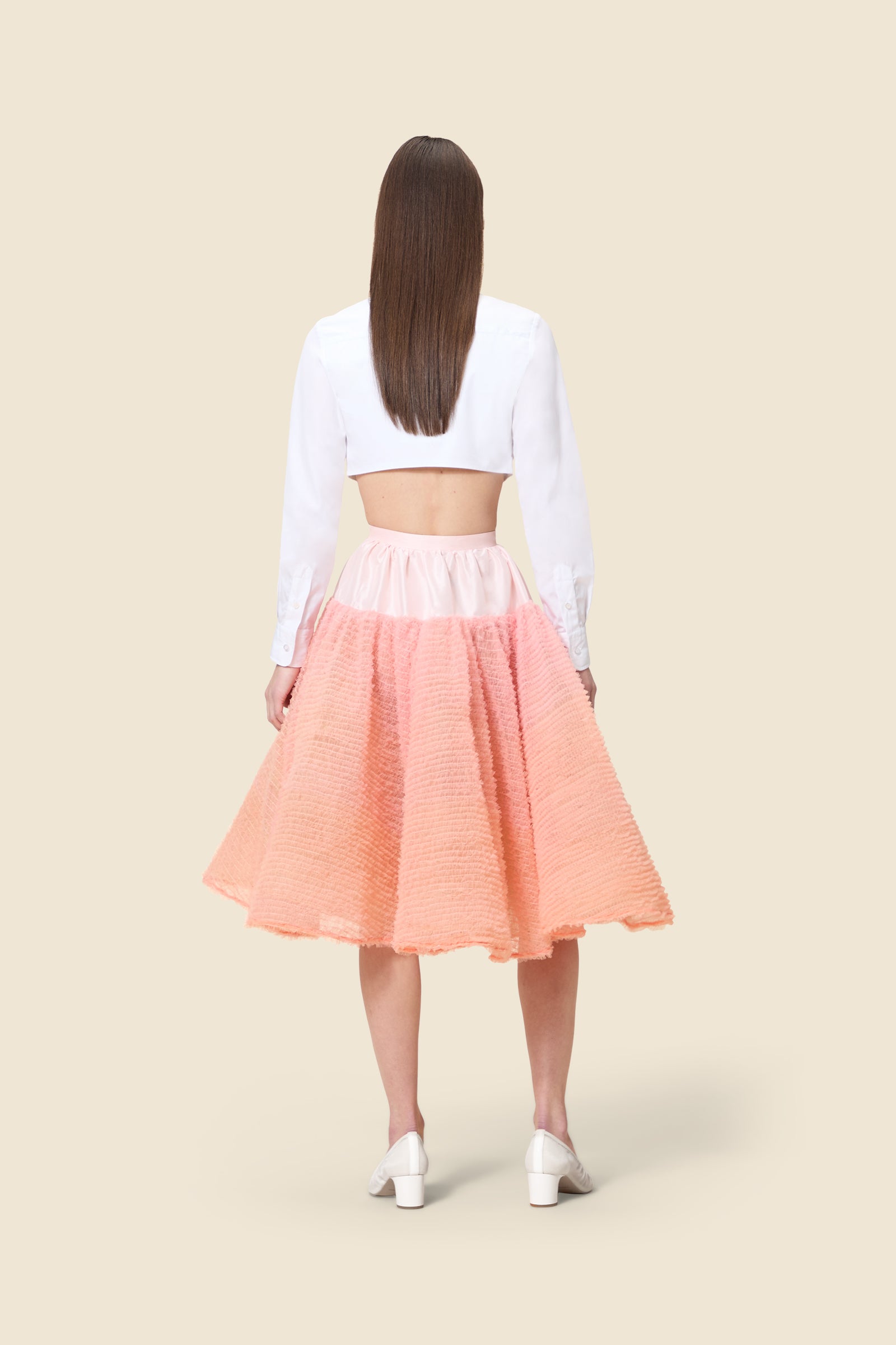 Inspired by the tulle from the ‘late stage capitalism waltz’ haute couture collection, the skirt features hand crafted tulle ruffles for a feminine texture
