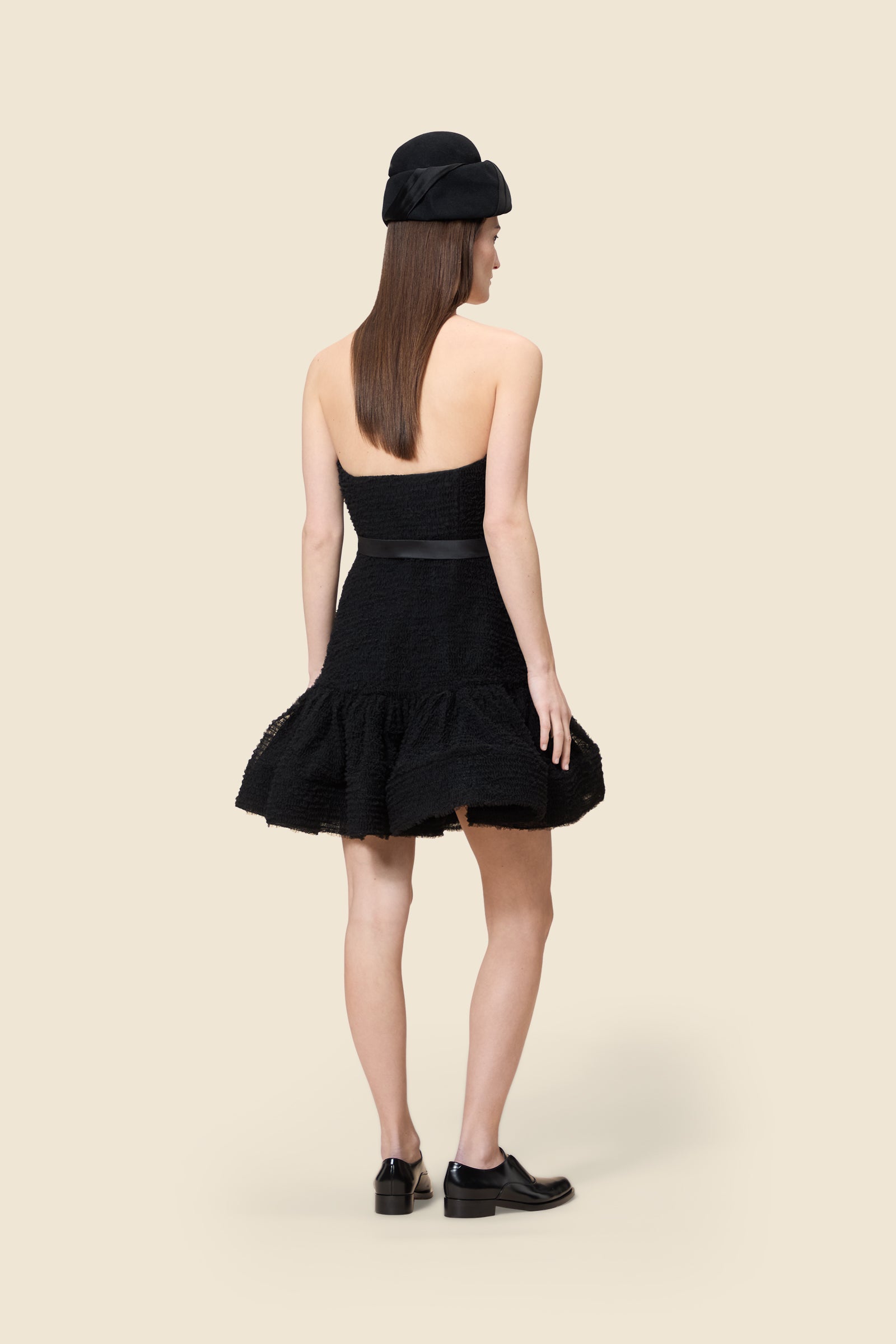 Inspired by the tulle from the ‘late stage capitalism waltz’ haute couture collection, the dress features hand crafted tulle ruffles for a feminine texture
