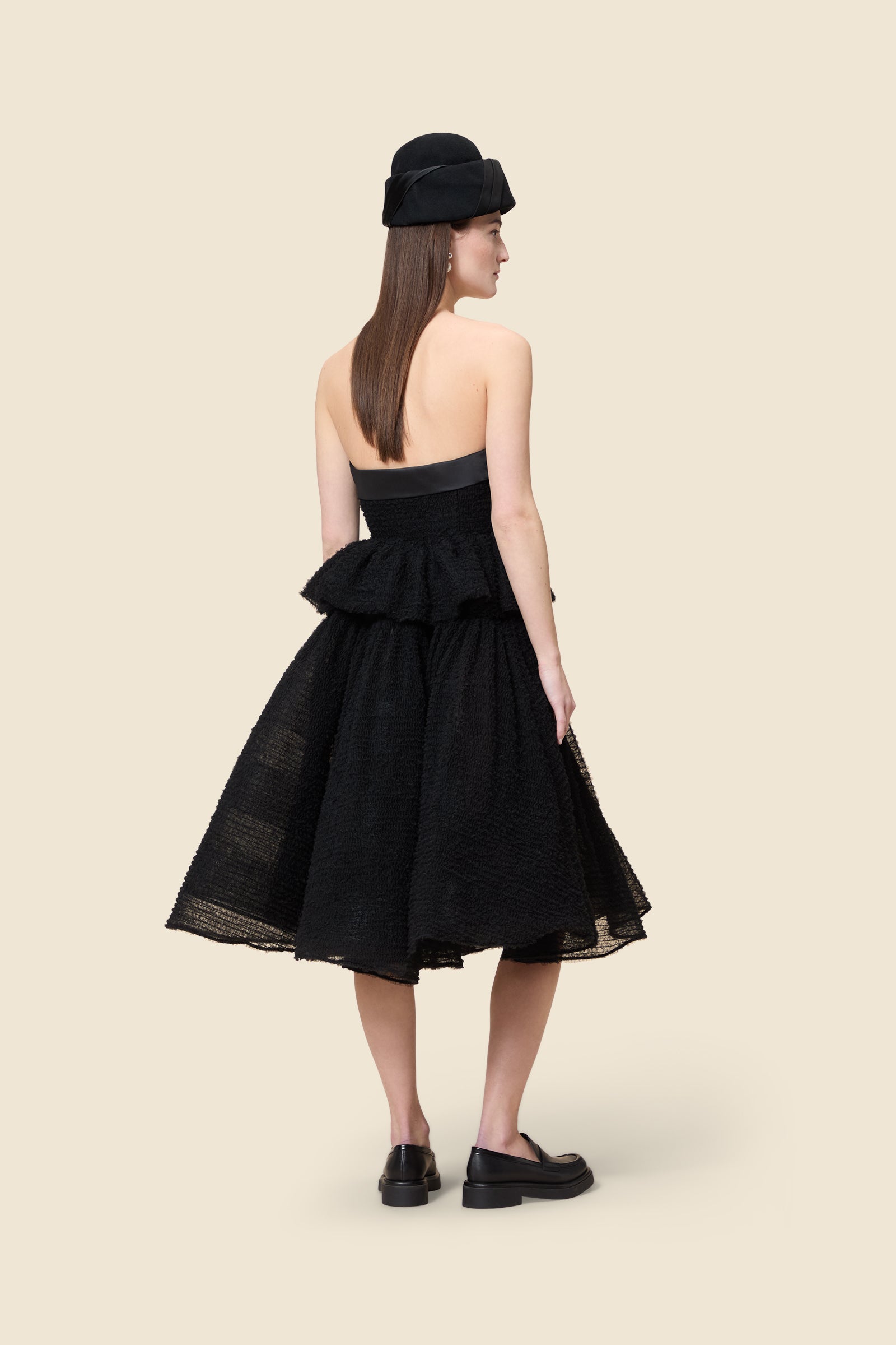 Inspired by the tulle from the ‘late stage capitalism waltz’ haute couture collection, the top features hand crafted tulle ruffles for a feminine texture