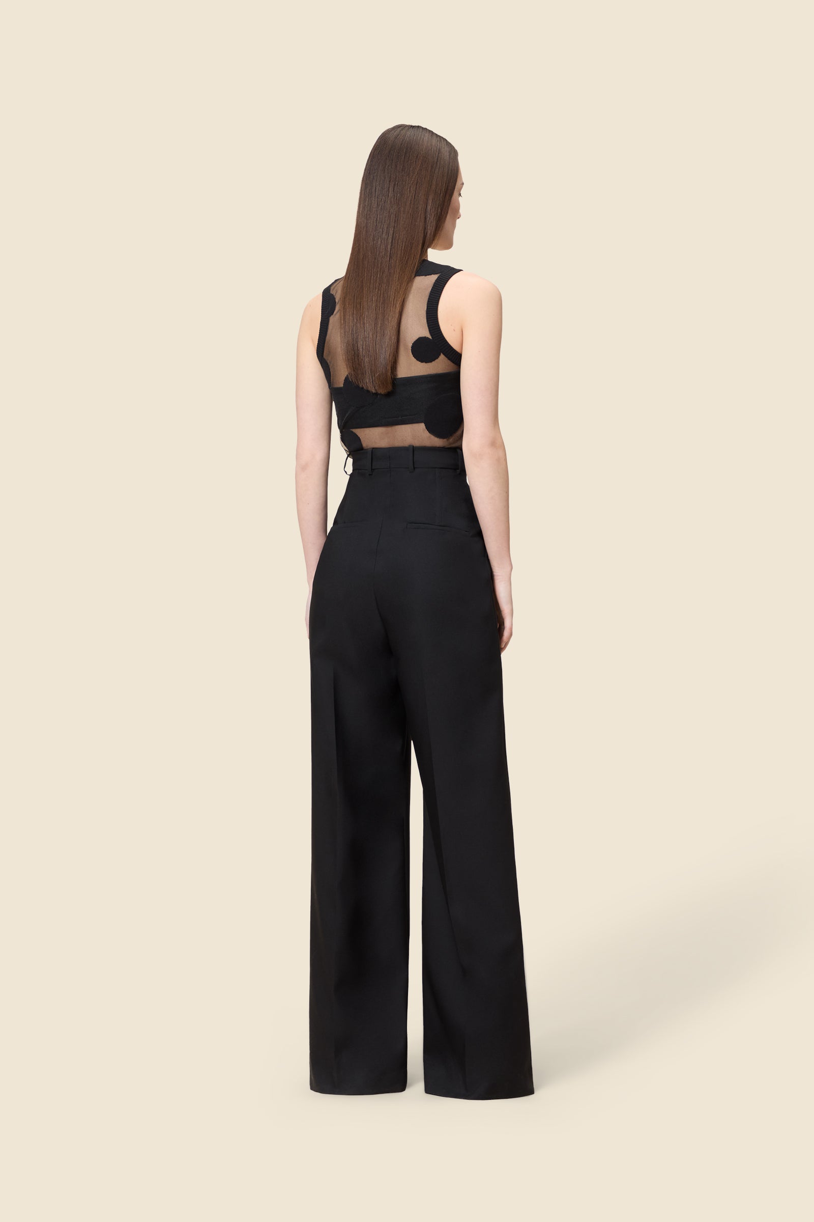 Crafted from wool, the super high waisted trousers offers a tailored fit and timeless elegance with a boning detail on the waist