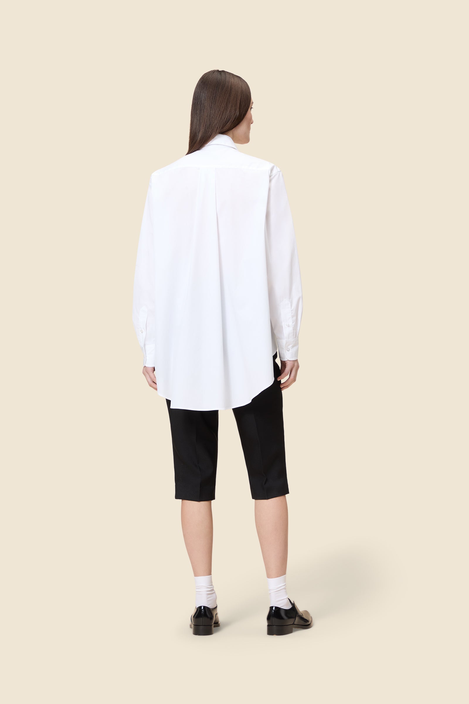 Drawing from viktor&rolf’s haute couture ‘red carpet’ collection, the shirt transforms traditional menswear patterns into a feminine, glamorous silhouette