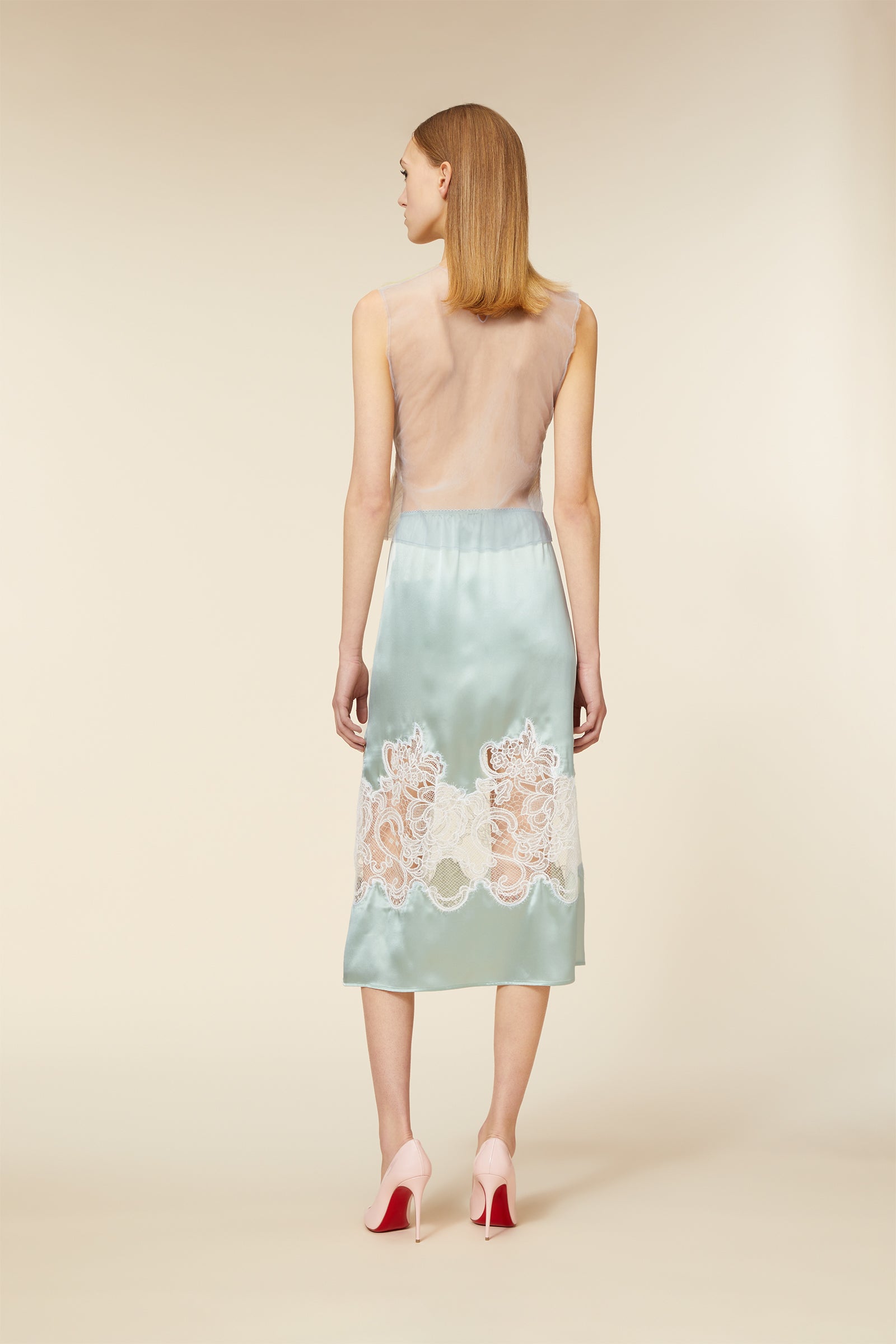 Crafted with delicate haute couture-inspired tulle, the top captures the essence of dreamlike elegance with subtle fabric movement