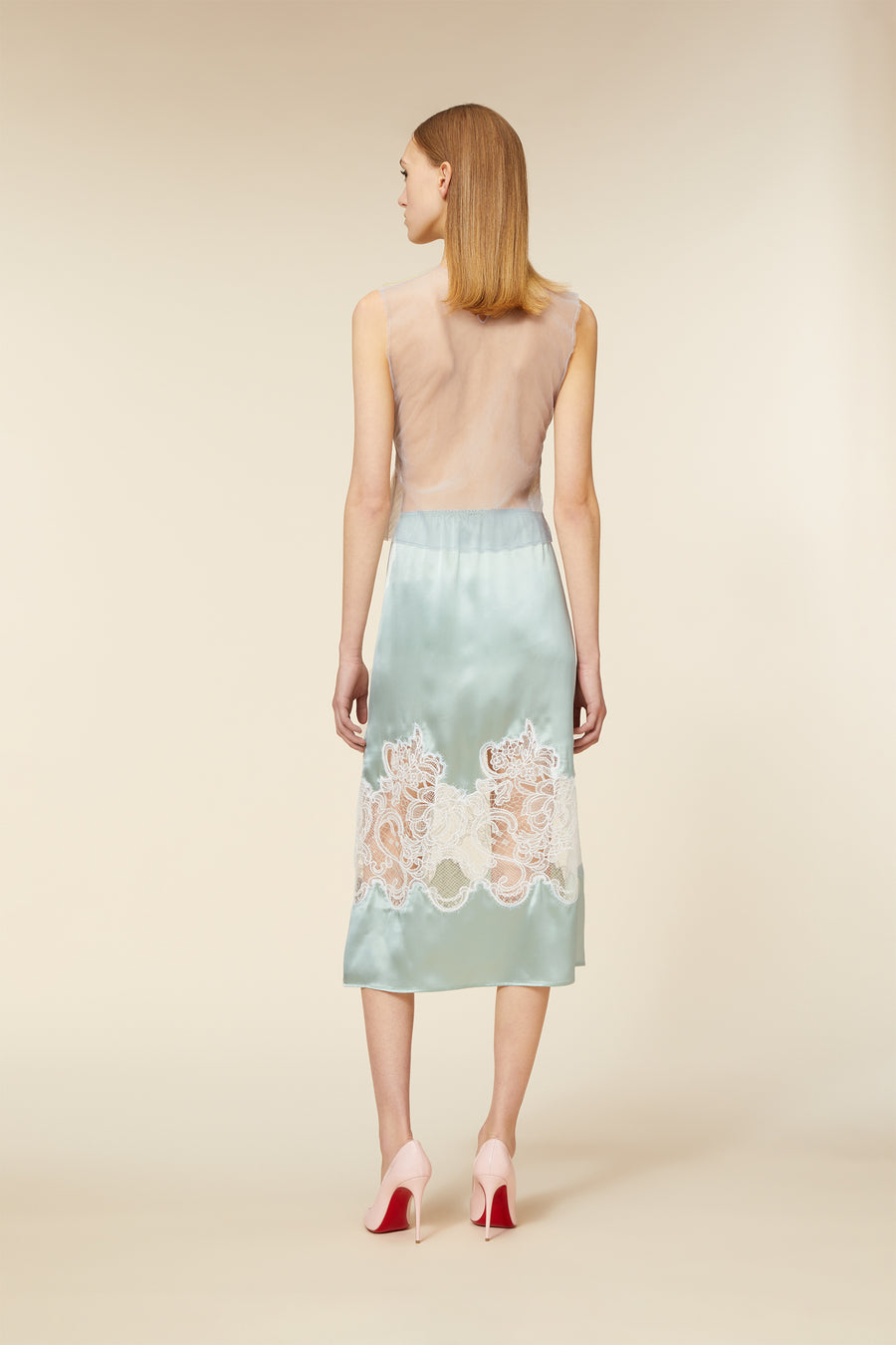 Crafted with delicate haute couture-inspired tulle, the top captures the essence of dreamlike elegance with subtle fabric movement