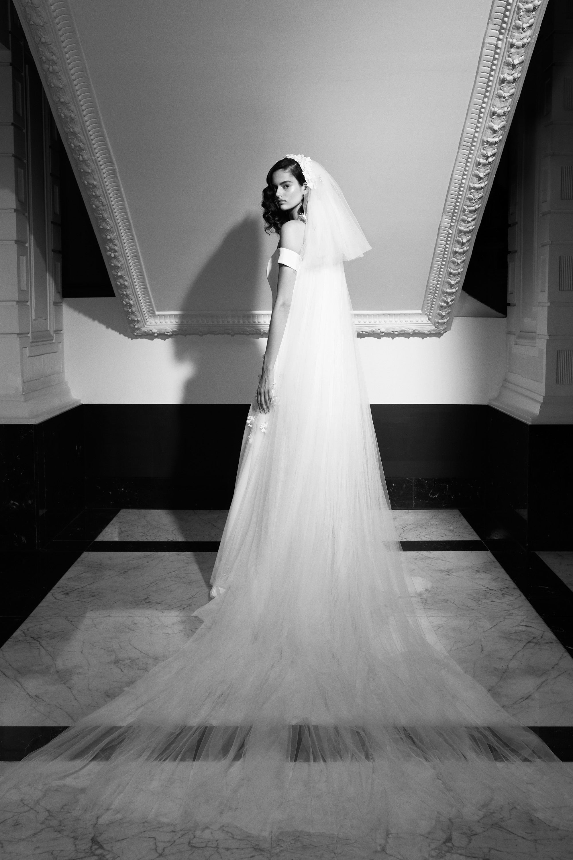 Viktor & Rolf Mariage Bridalwear Collection elegant floor-length gown with detailed tulle veil and sculptural silhouette.