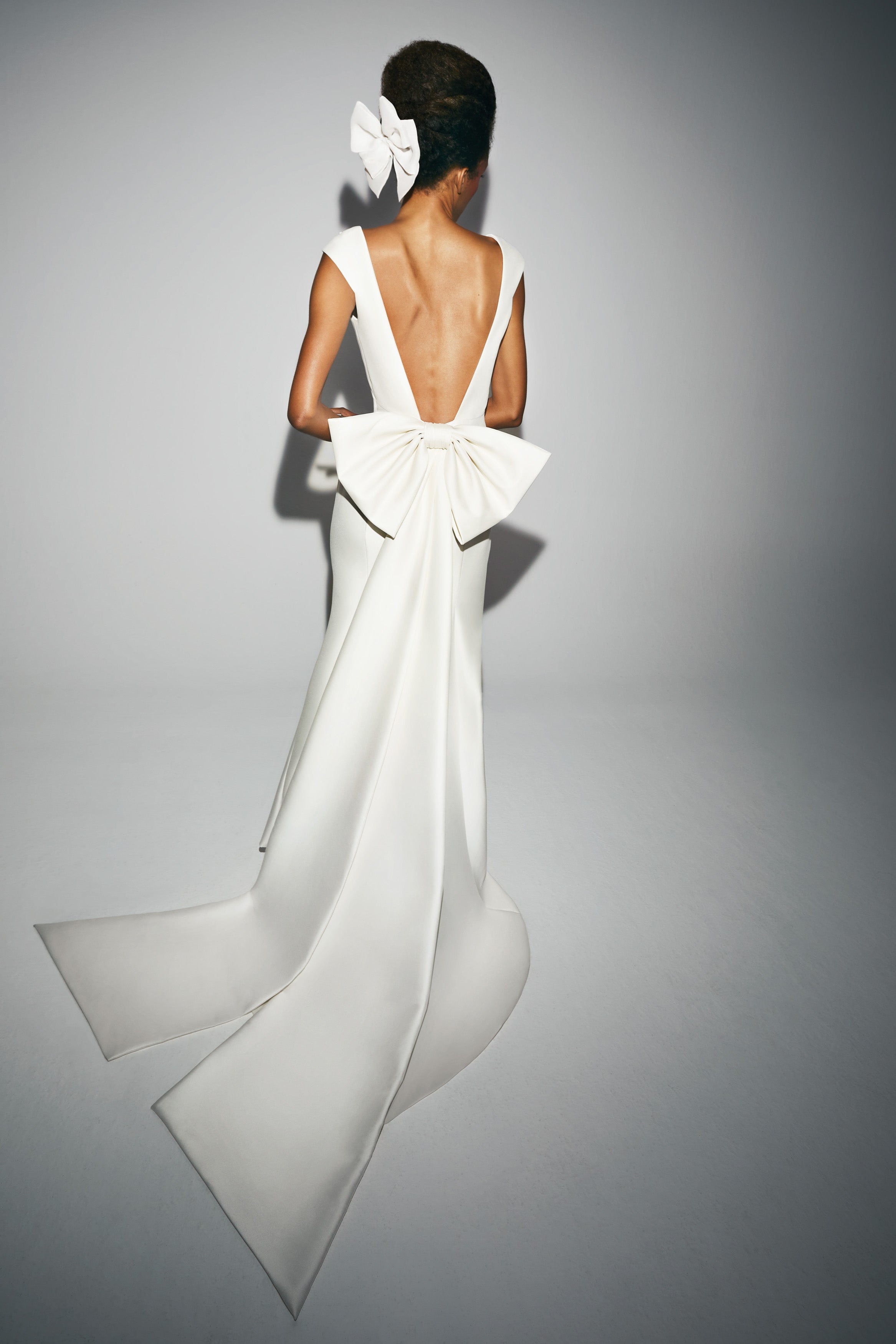 Chic mermaid gown with empire seaming crafted from mikado with a slight stretch which allows the dress to perfectly sculpt the wearer’s body