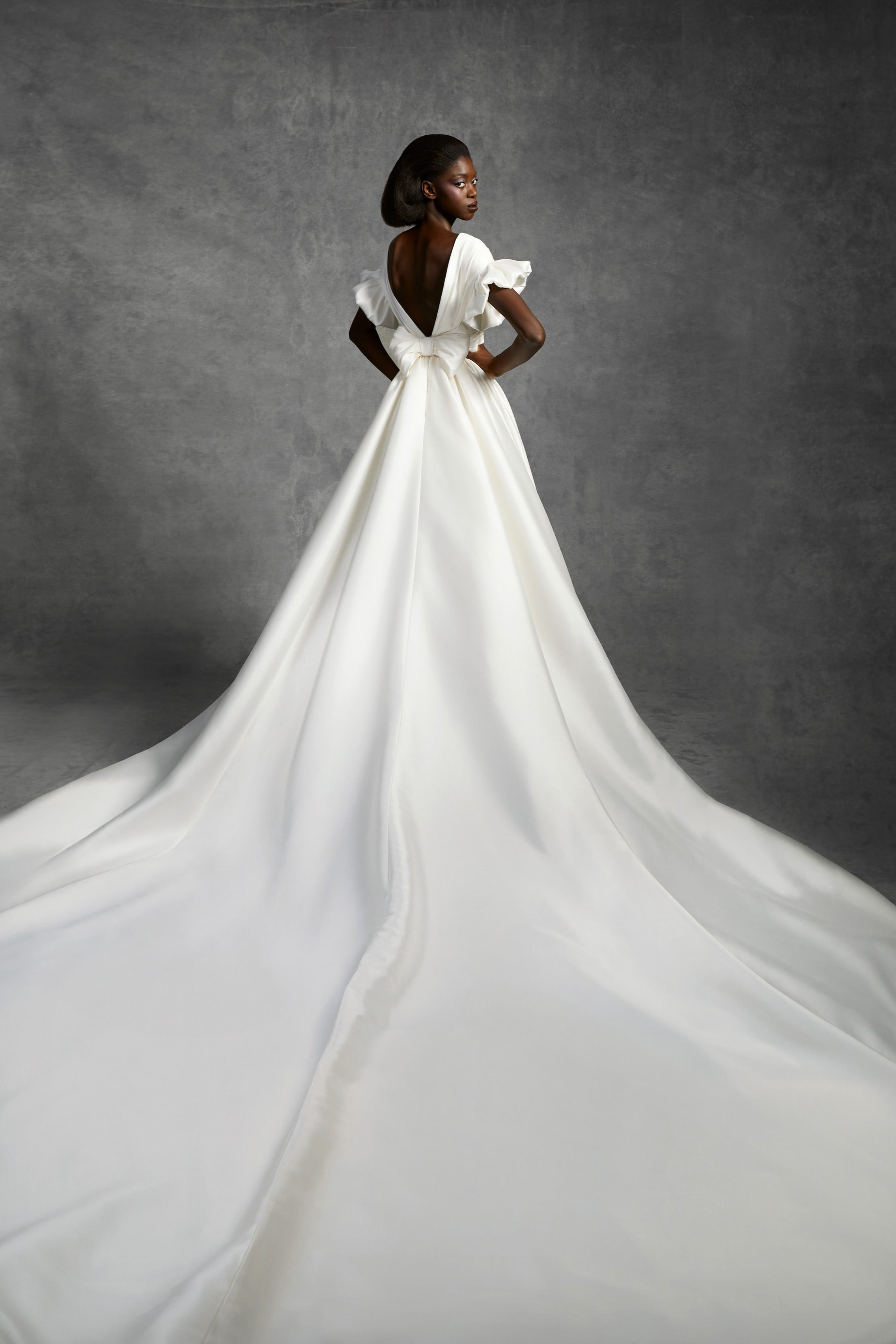 Timeless a-line gown featuring a v-neckline crafted from soft mikado