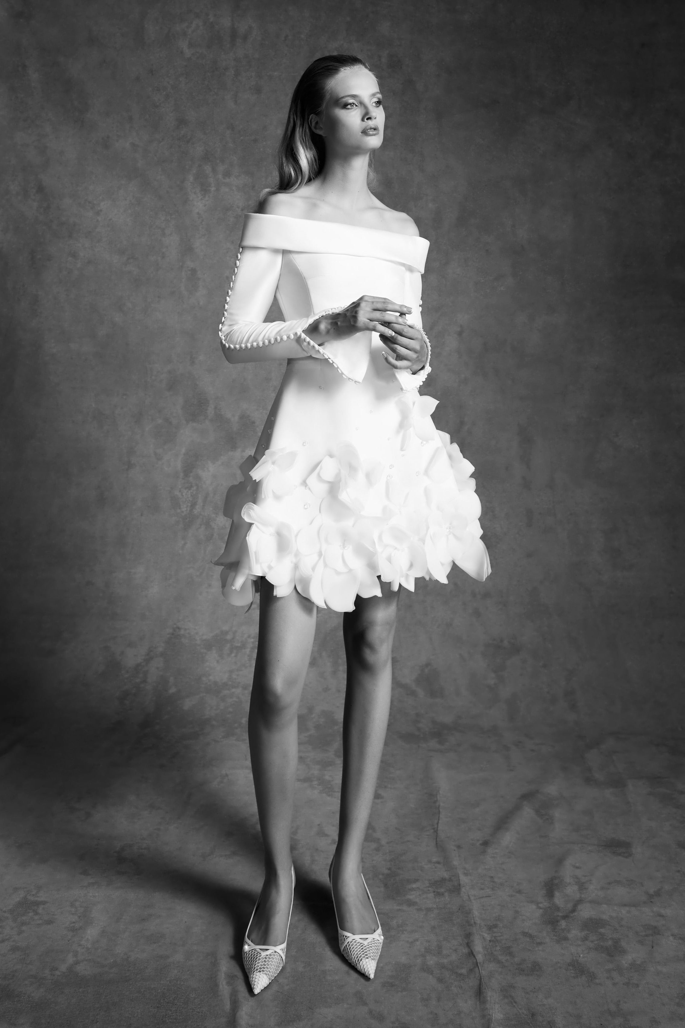 Off-shoulder, short a-line dress crafted from mikado with a slight stretch which allows the dress to perfectly sculpt the wearer's body