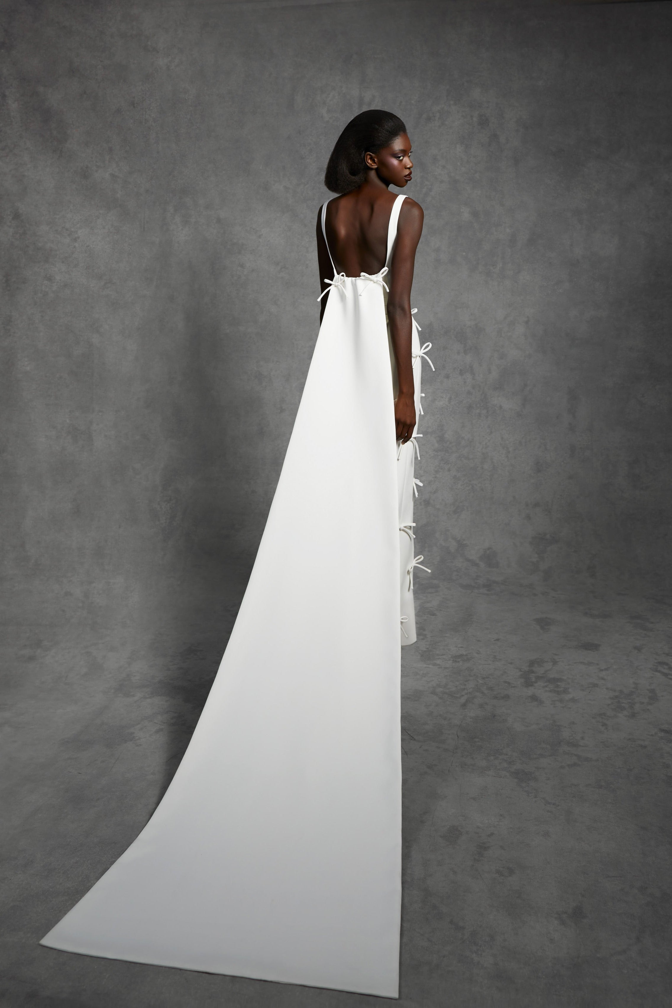Timeless empire gown with a classic squared neckline and empire waistband, crafted from double-faced crepe with a matte finish