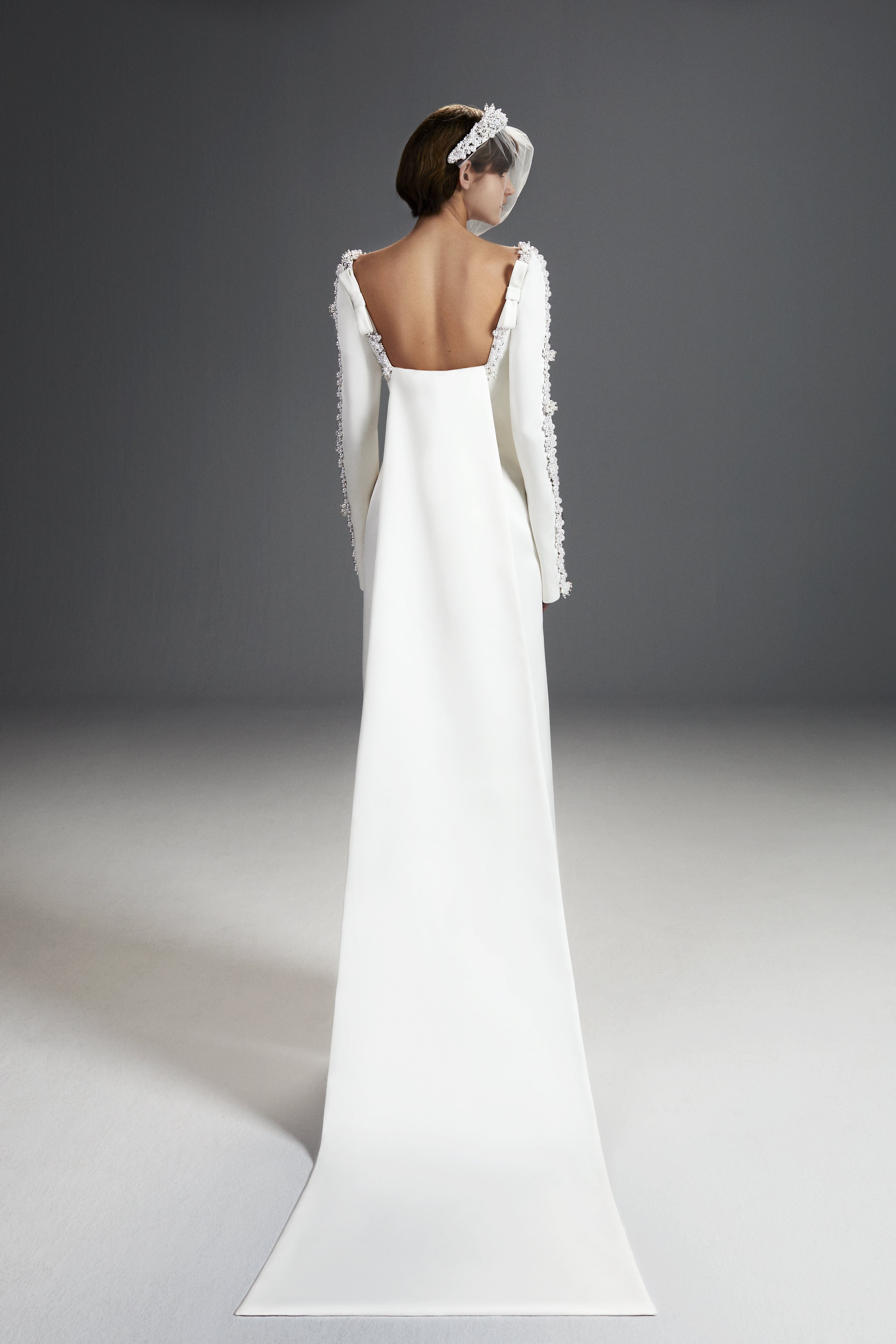 Viktor & Rolf Mariage Bridalwear Collection features elegant Tales of Pearls column gown with intricate shoulder embellishments.