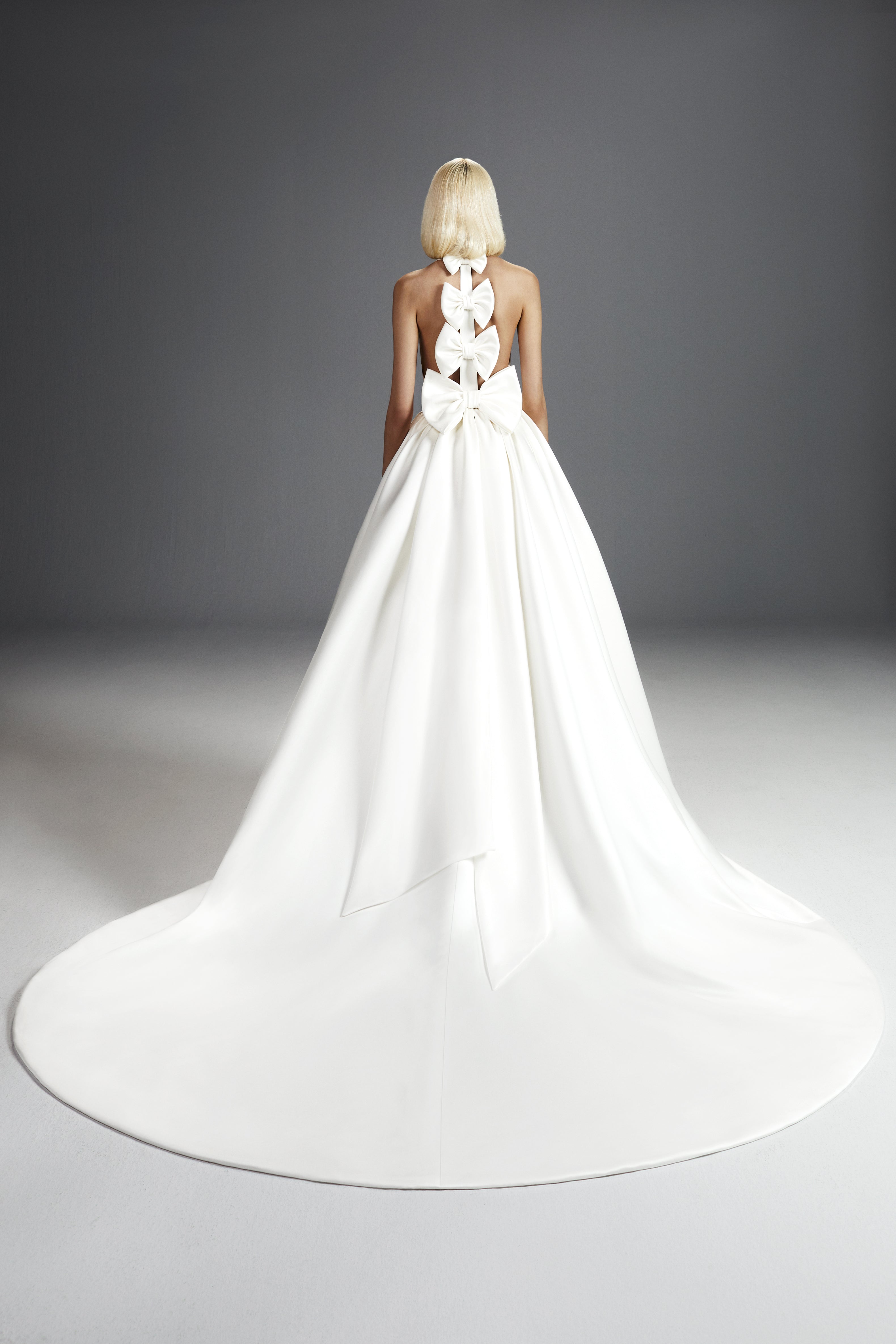 Viktor & Rolf Mariage Bridalwear Collection, Dreamy bow gown, elegant back design featuring layered bows and flowing train.
