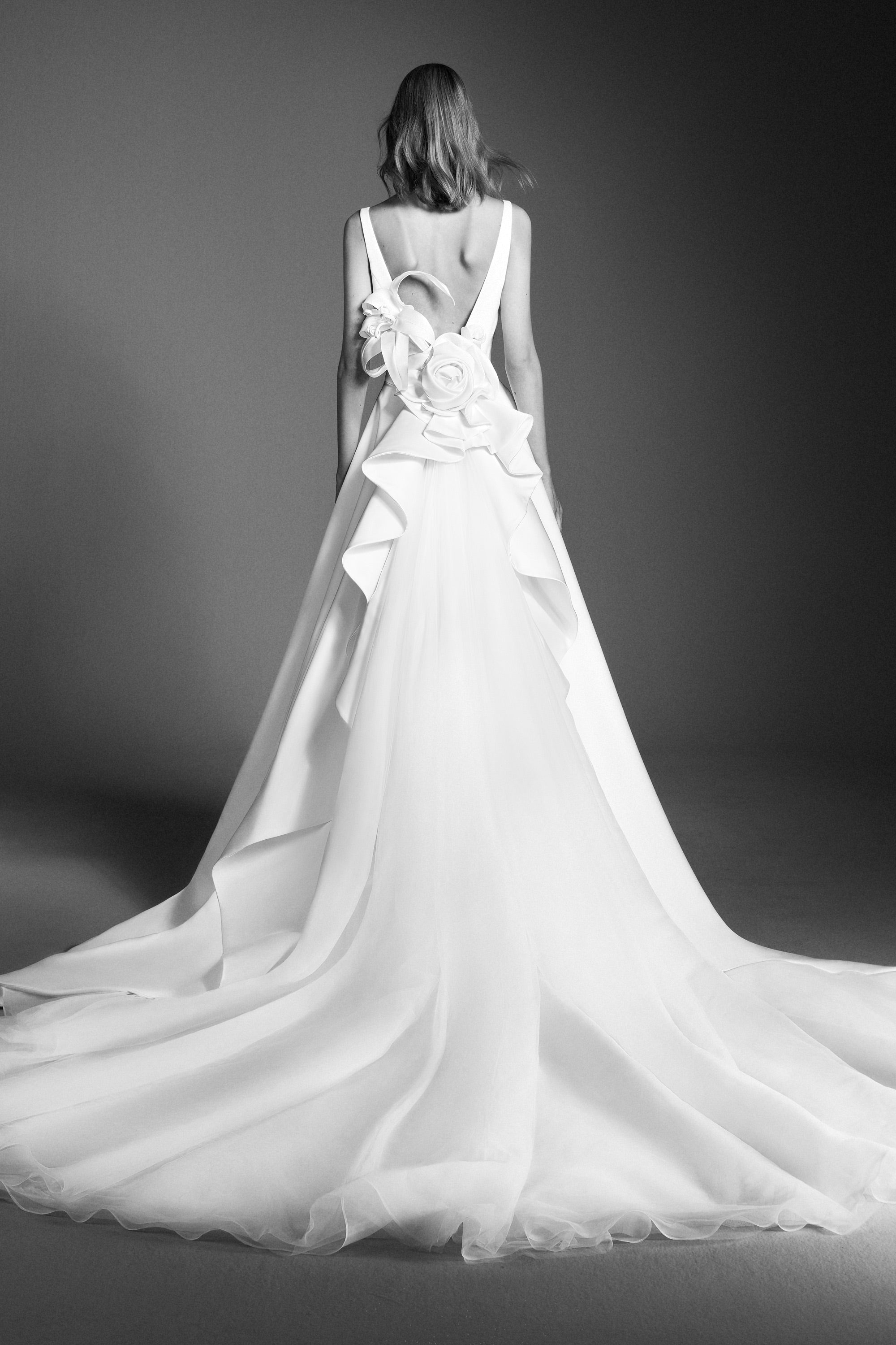 Elegant and timeless, this a-line satin gown boasts a clean boat neck