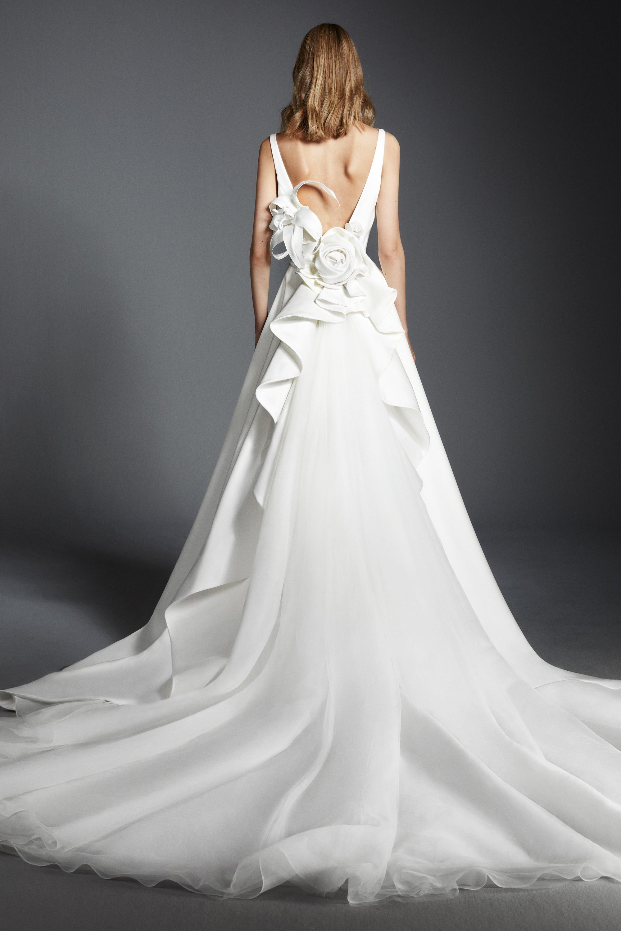 Elegant and timeless, this a-line satin gown boasts a clean boat neck
