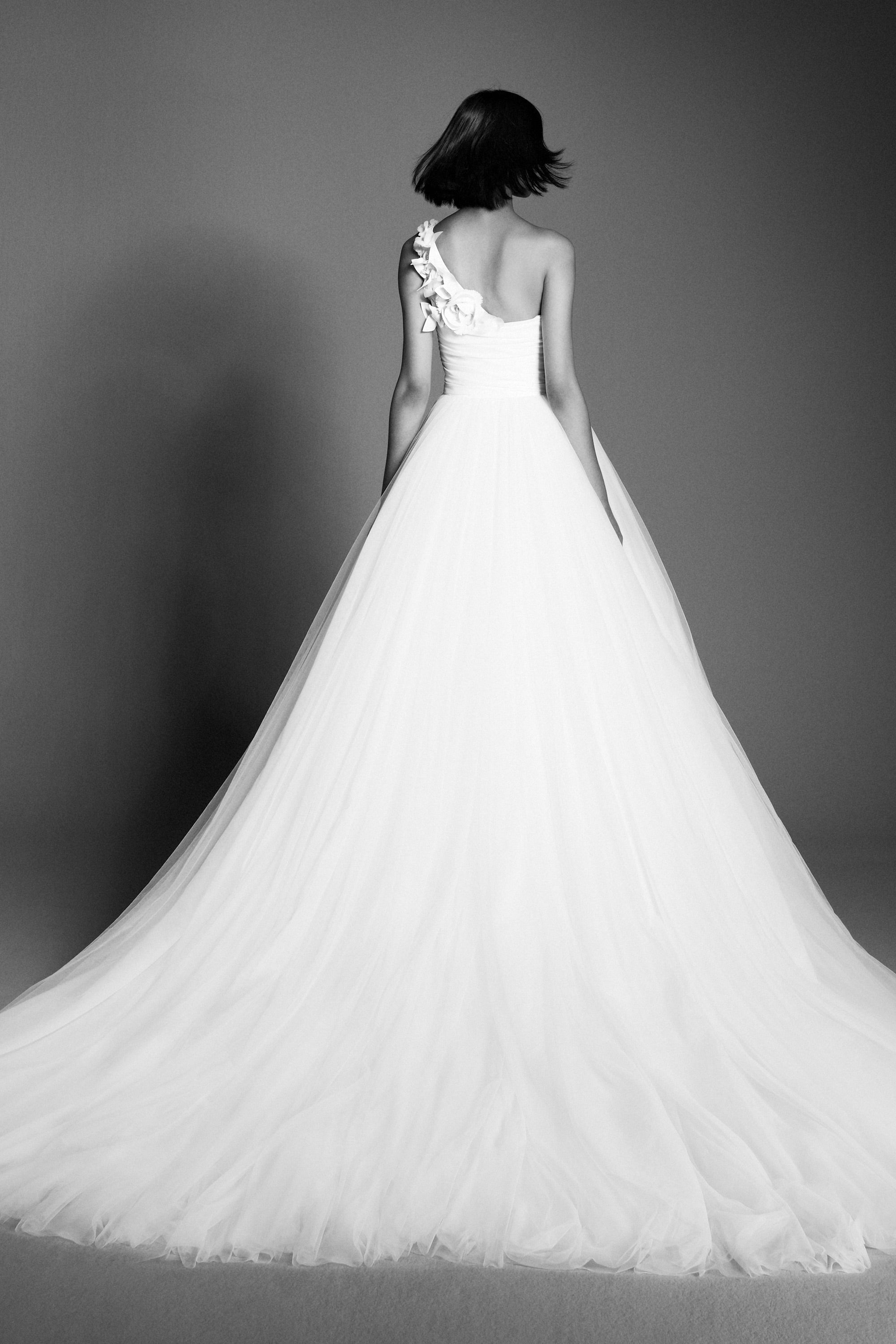 Lovely gown crafted from tulle with a mikado organza draped bodice