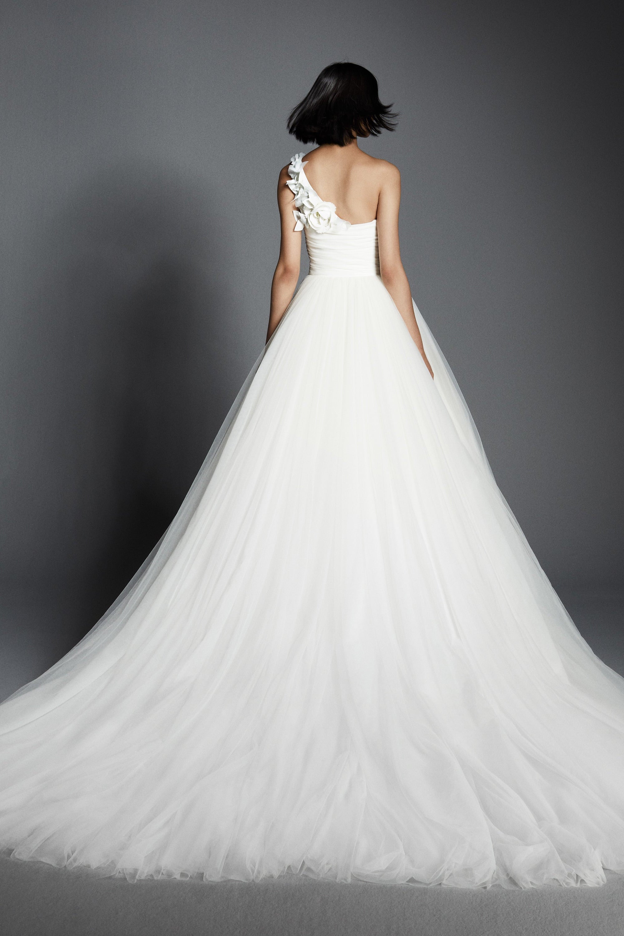 Lovely gown crafted from tulle with a mikado organza draped bodice