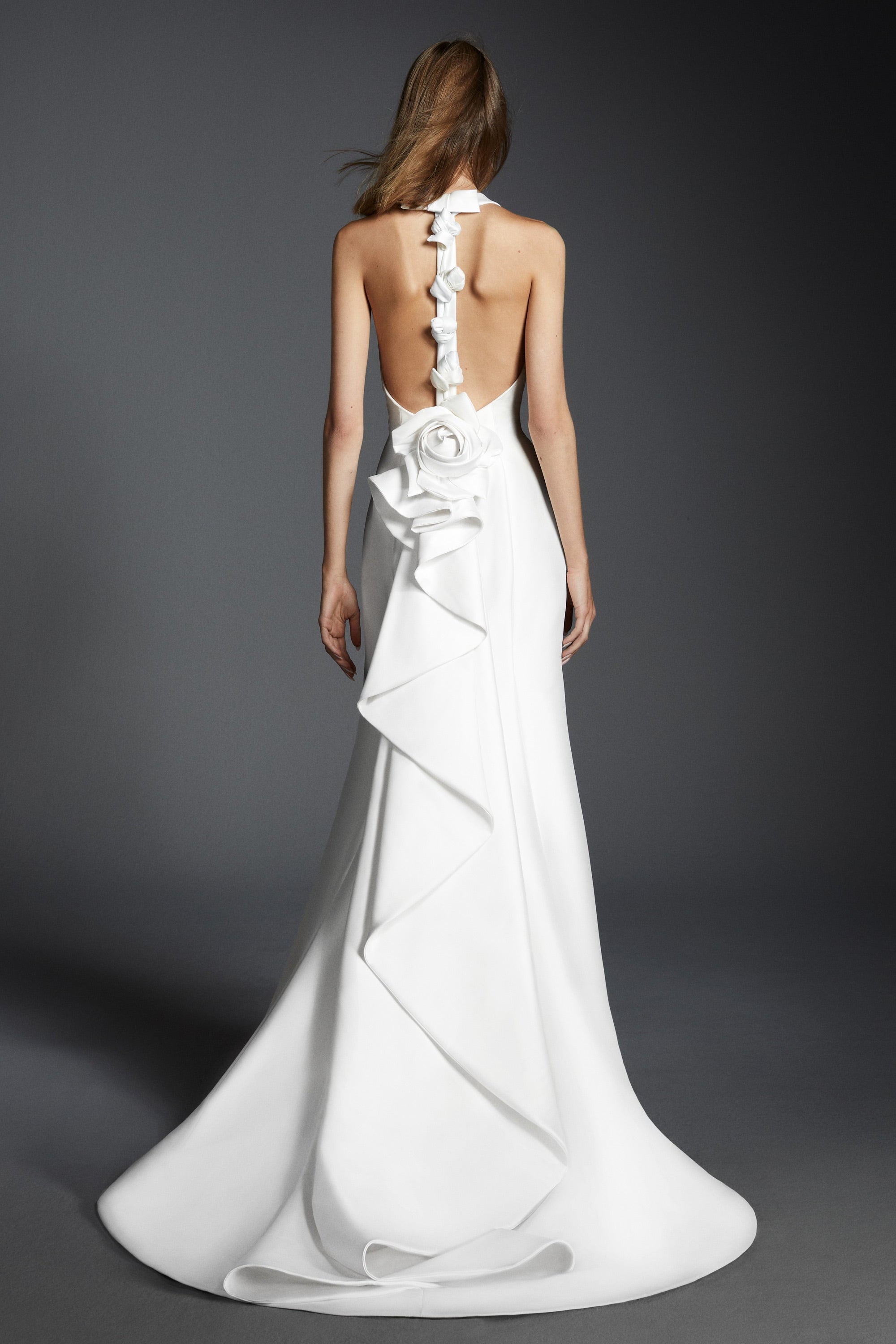 This elegant mermaid gown features a stretch mikado fabric which allows the dress to perfectly mold to the wearer’s body