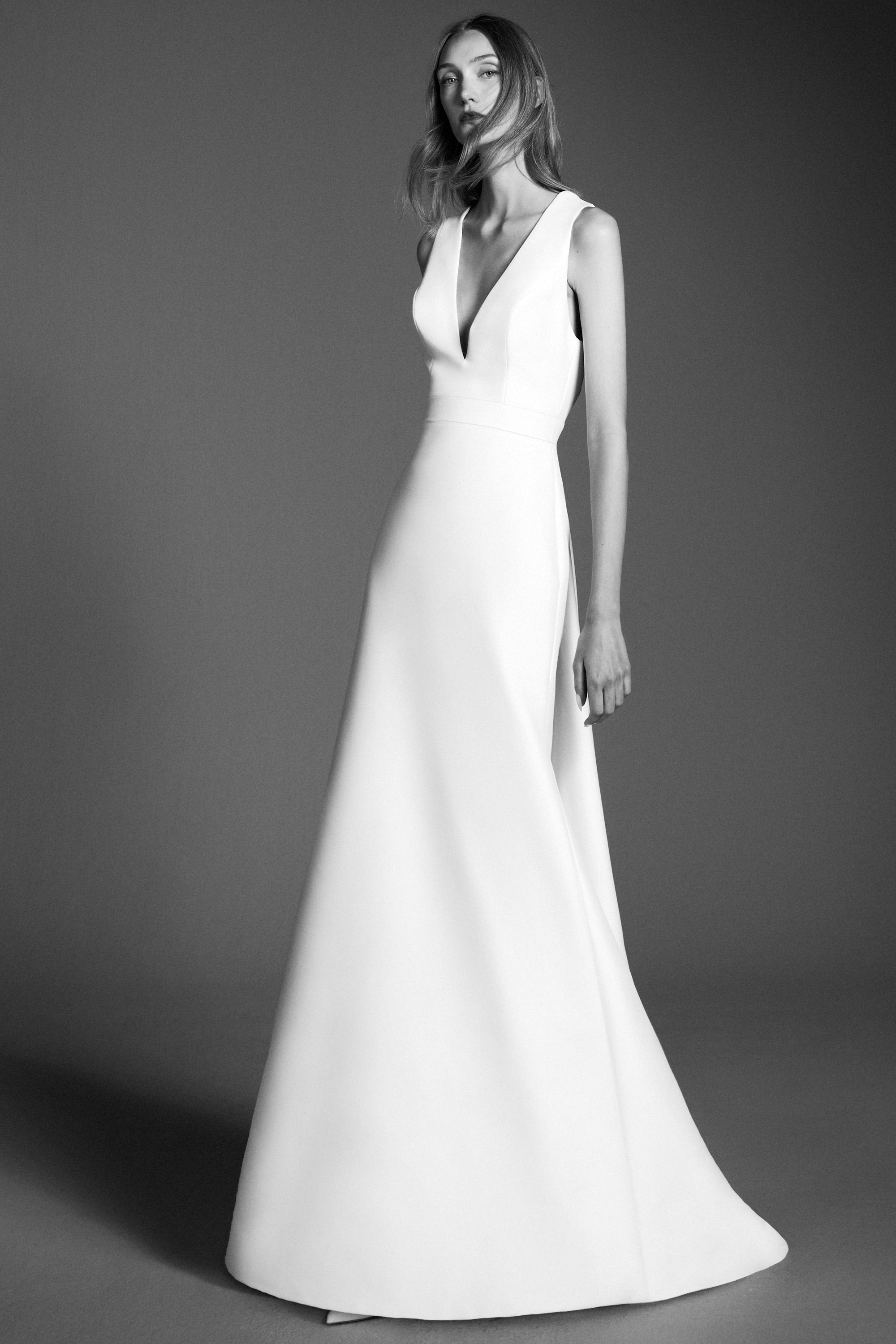 Chic mermaid gown crafted out of mikado with a slight stretch, featuring an elegant plunging v-neckline