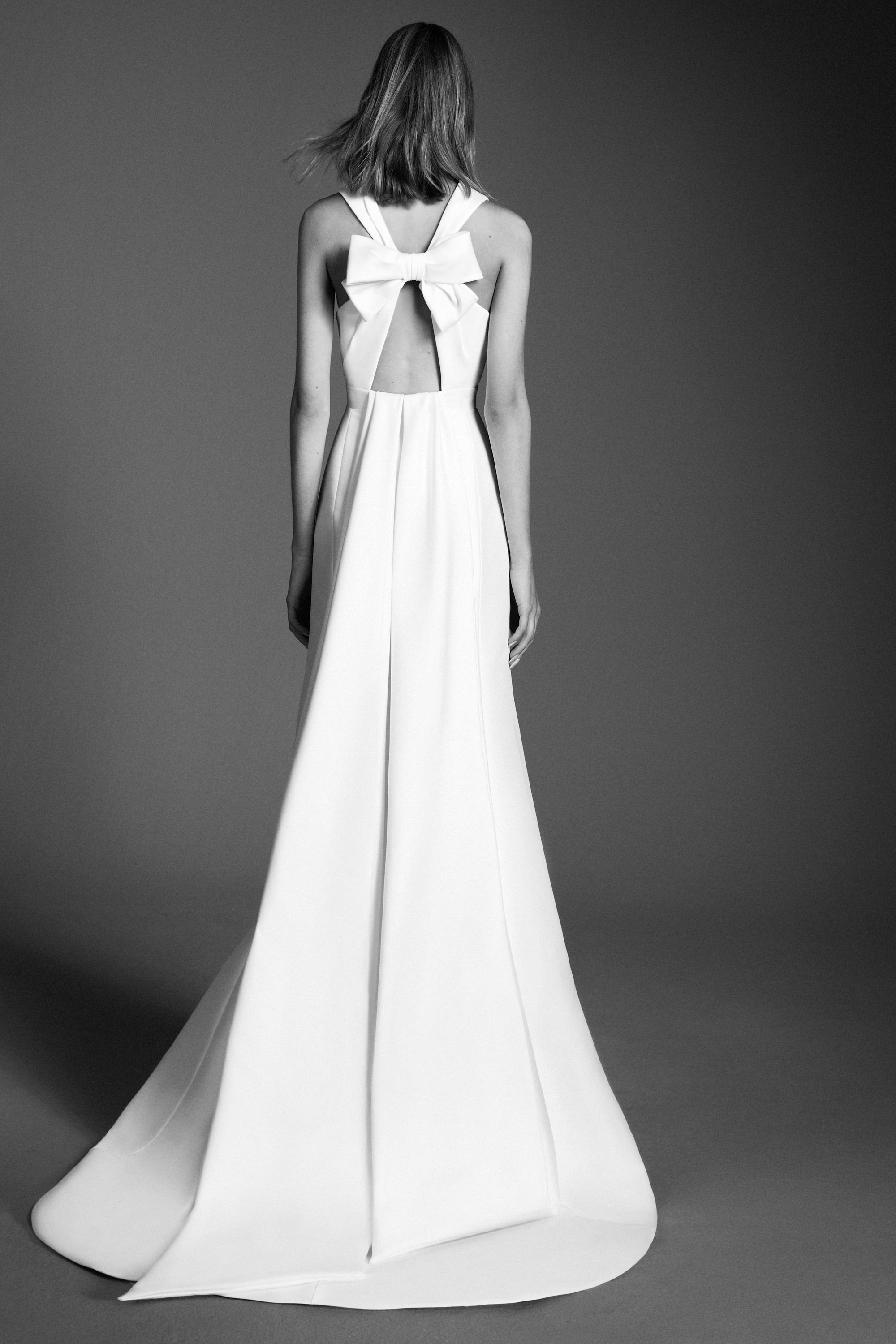Chic mermaid gown crafted out of mikado with a slight stretch, featuring an elegant plunging v-neckline