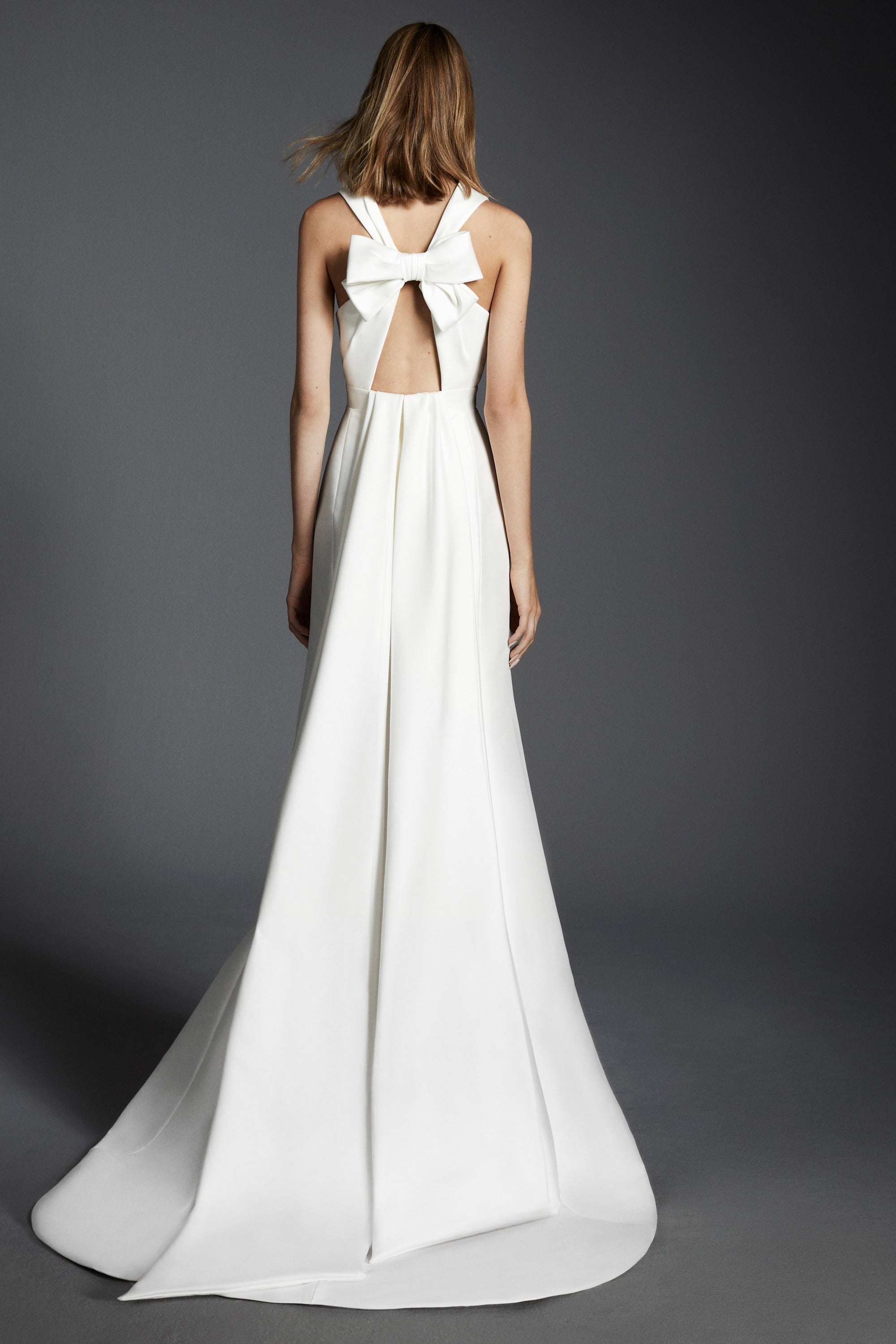 Chic mermaid gown crafted out of mikado with a slight stretch, featuring an elegant plunging v-neckline