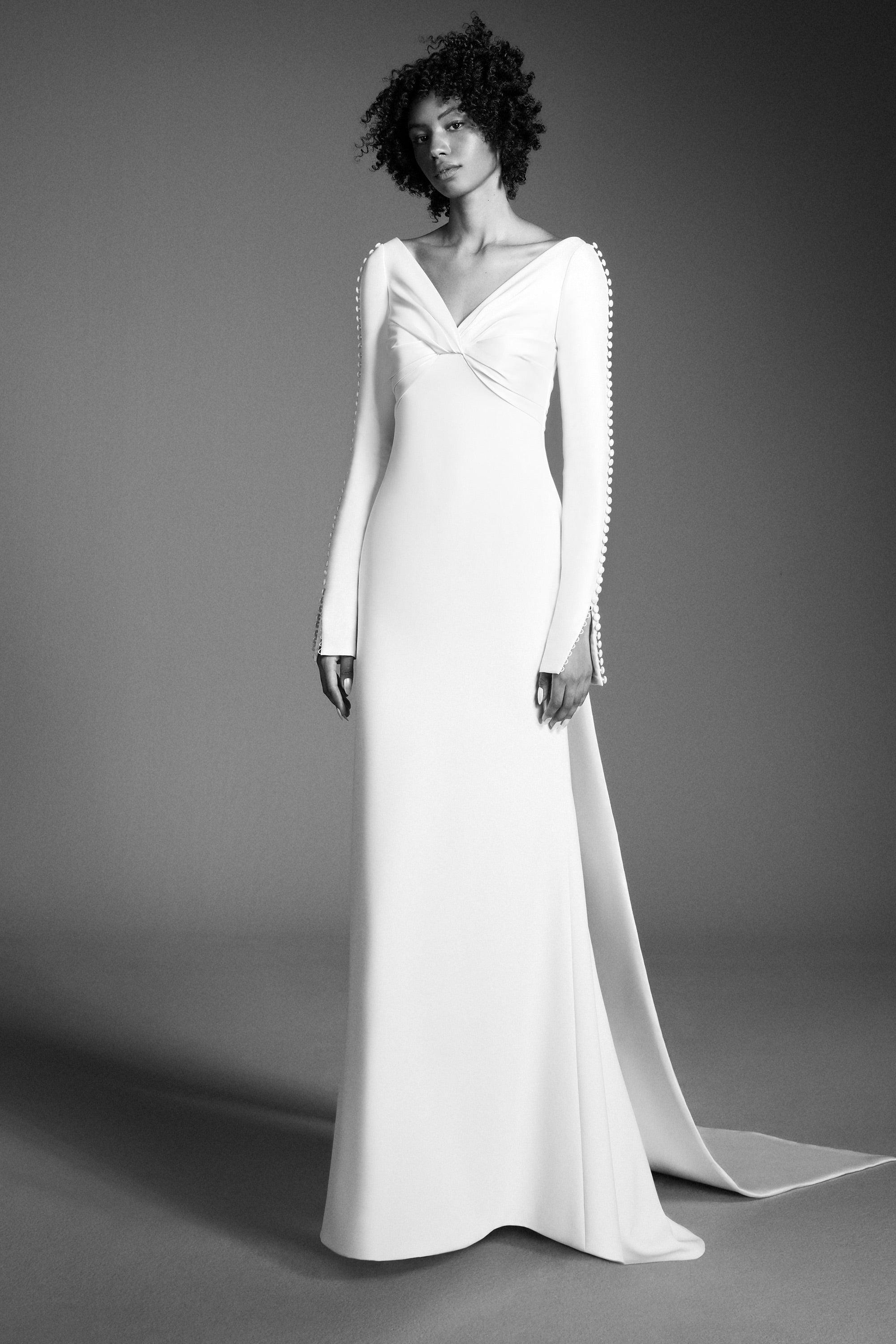 Chic mermaid gown featuring a draped stretch mikado empire bodice