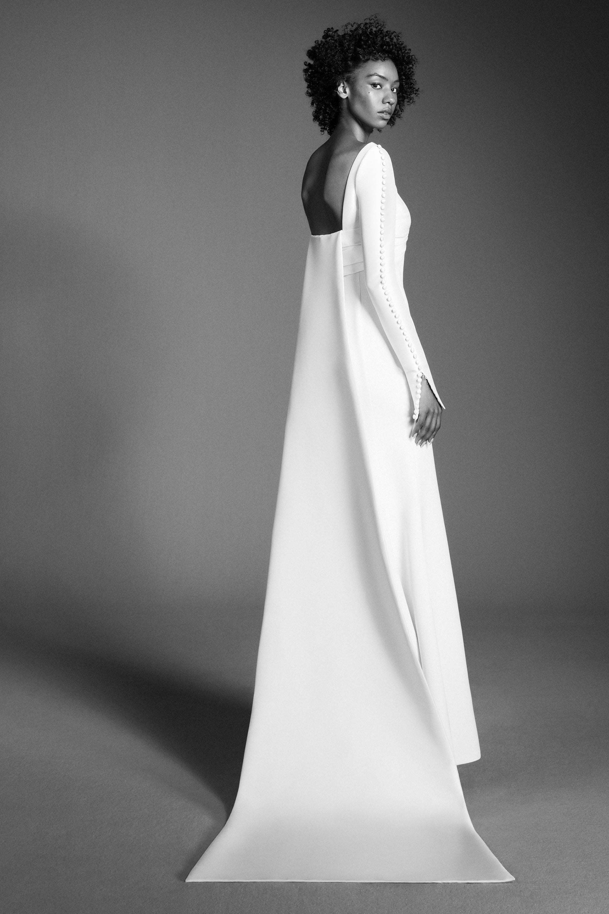 Chic mermaid gown featuring a draped stretch mikado empire bodice