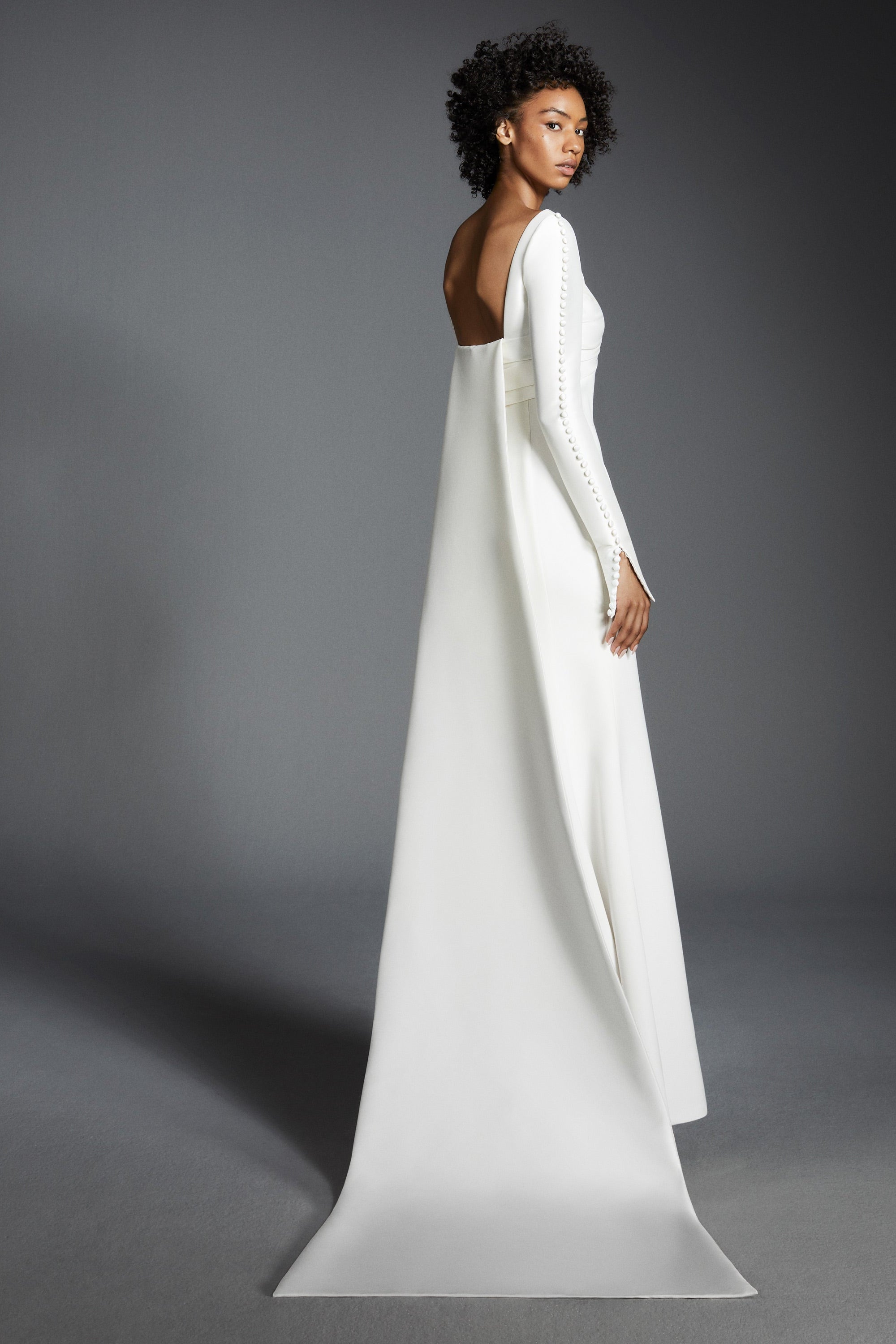 Chic mermaid gown featuring a draped stretch mikado empire bodice