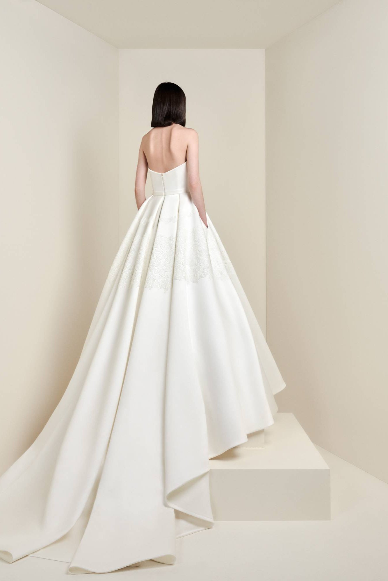 This a-line gown is meticulously crafted from satin fabric adorned with delicate lace em-bellishments