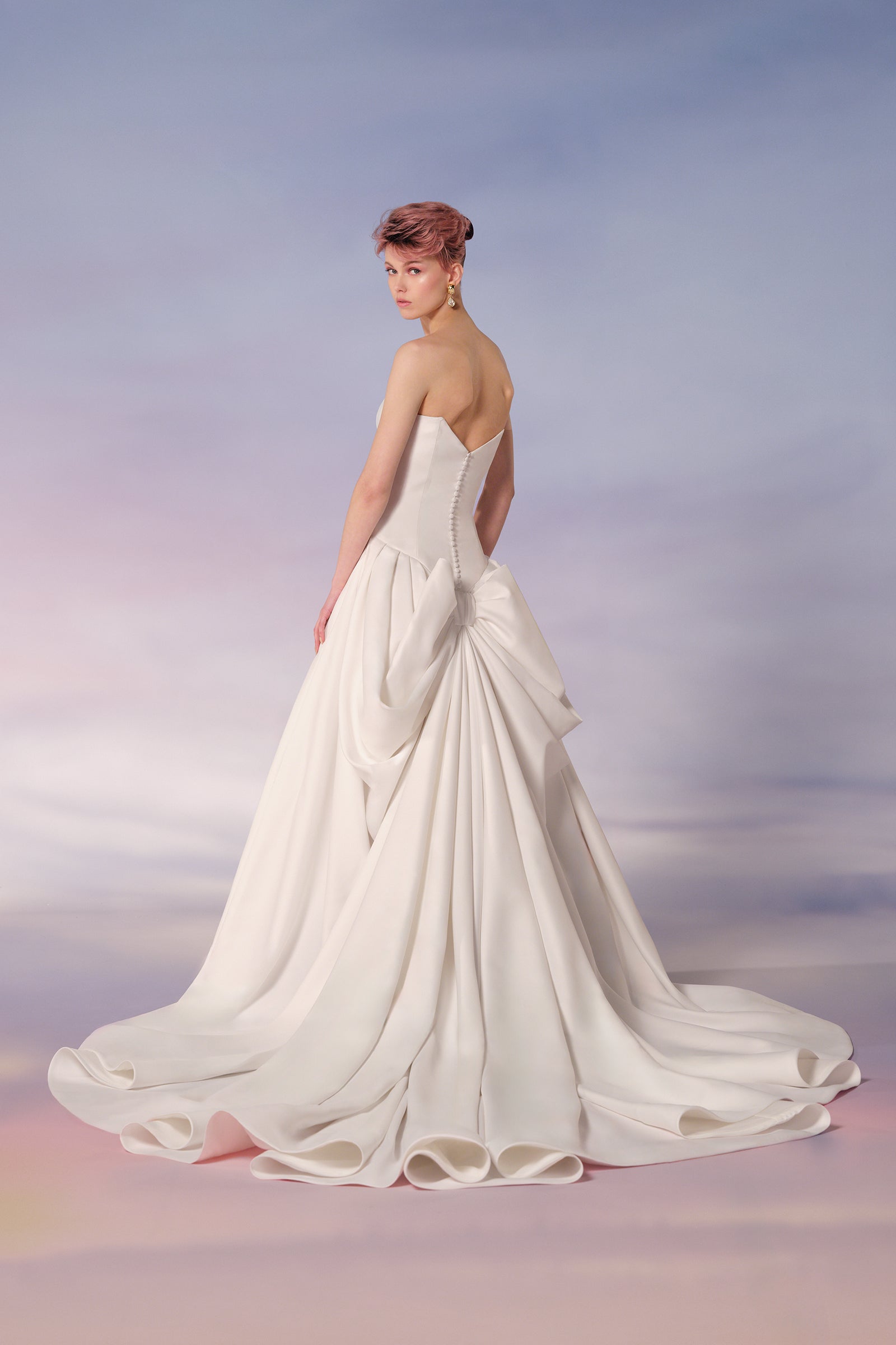 An off-shoulder sweetheart neckline meets a voluminous skirt in this light mikado a-line gown, from the Viktor&Rolf Mariage collection.