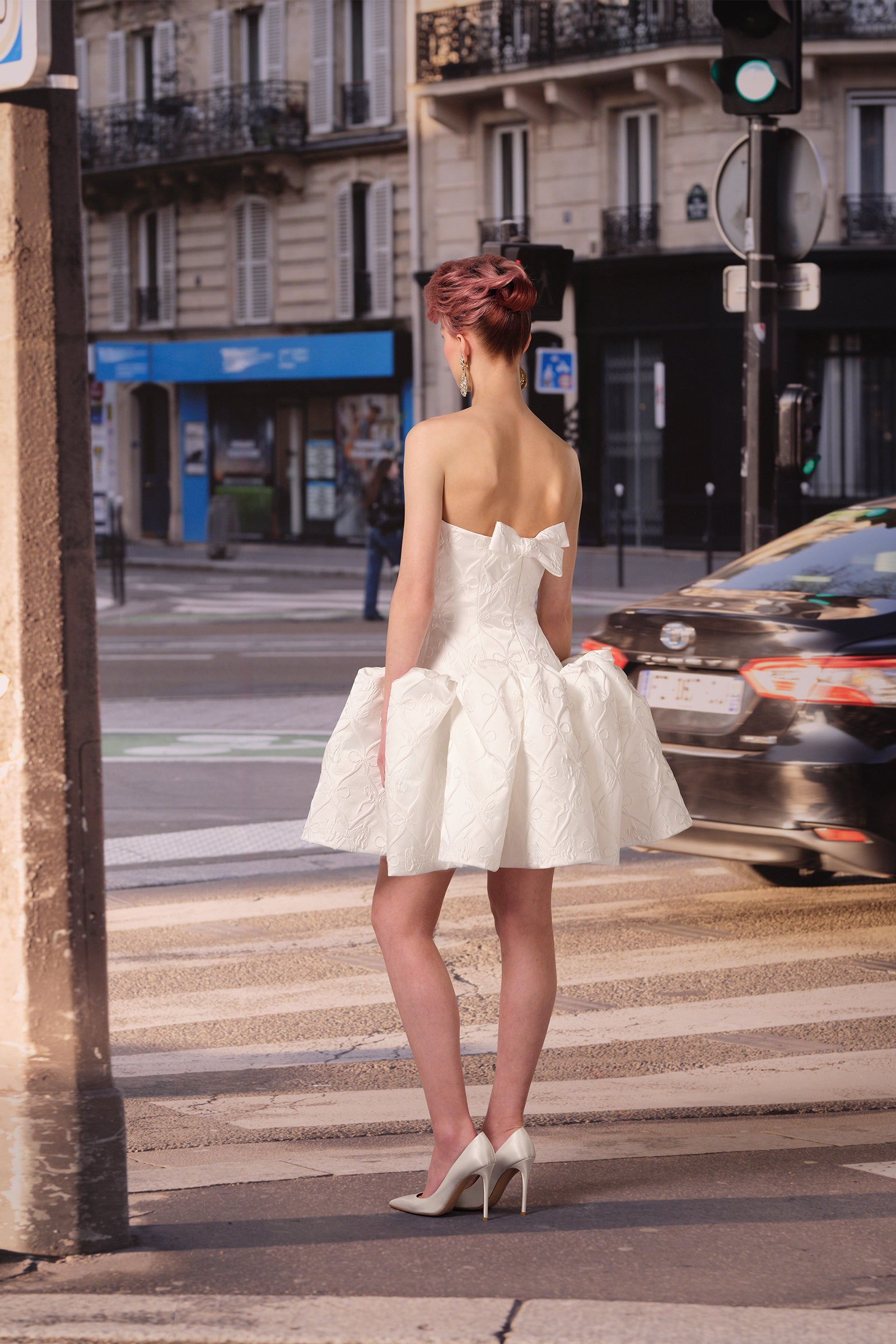 A playful mini dress crafted in our exclusive custom bow jacquard, from the Viktor&Rolf Mariage collection.