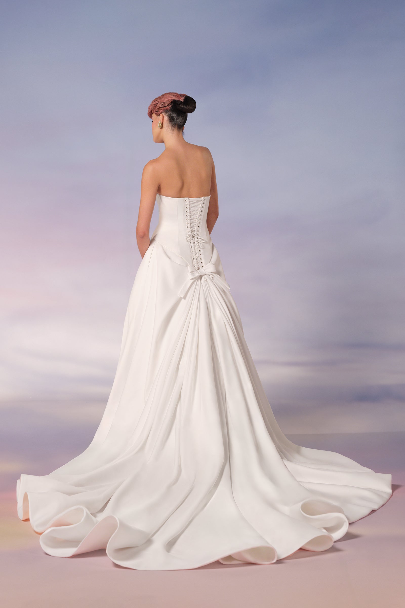 This light mikado a-line gown exudes regal elegance with its refined simplicity and dramatic details, from the Viktor&Rolf Mariage collection.