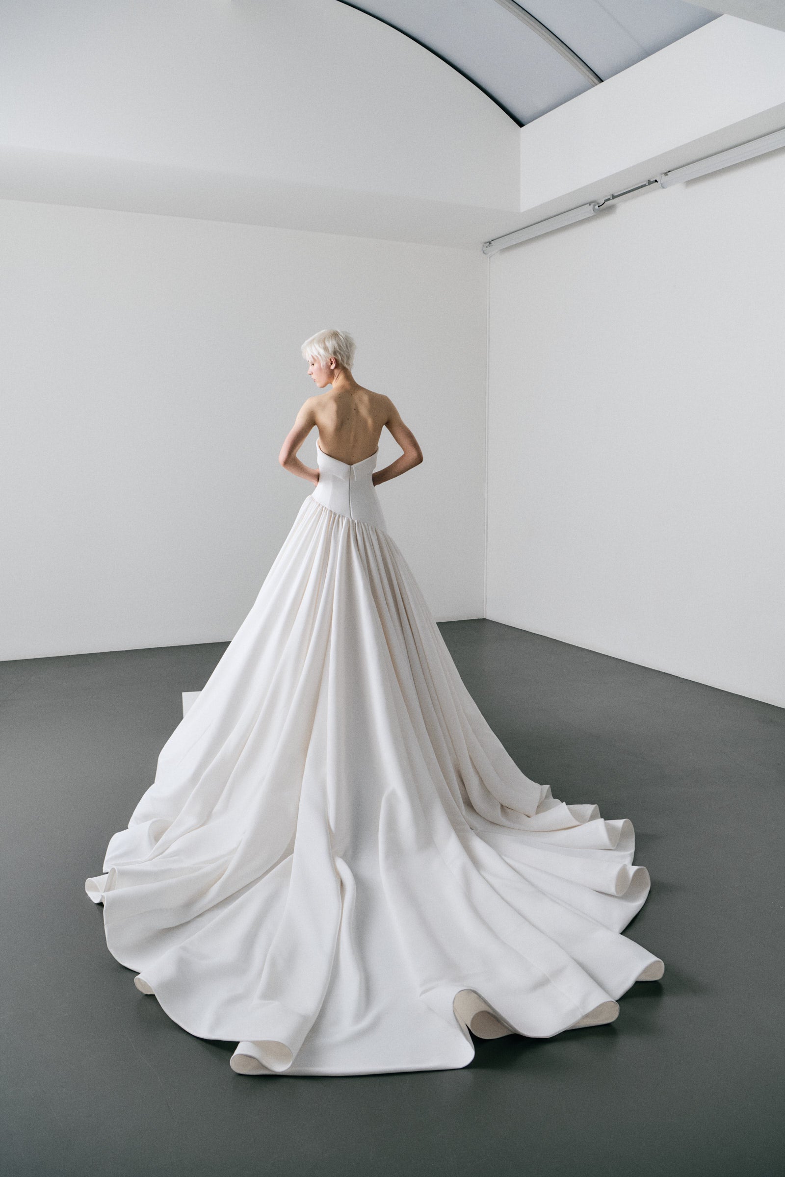 White wedding dress on a model in a minimalistic setting