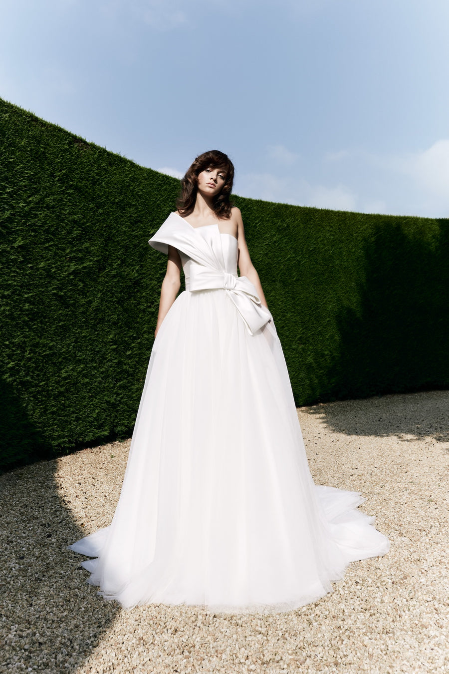 Viktor & Rolf Mariage Bridalwear AW25 Collection gown, asymmetric neckline with sculptural bow, couture craftsmanship.