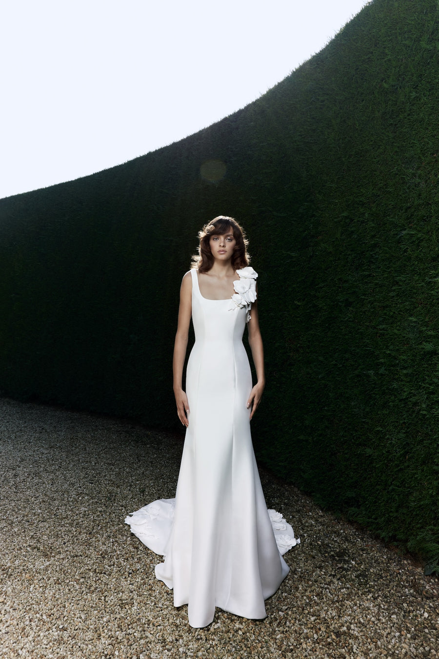 Viktor & Rolf Mariage Bridalwear Autumn Winter 25 Collection, elegant gown with floral shoulder detail and sleek design.