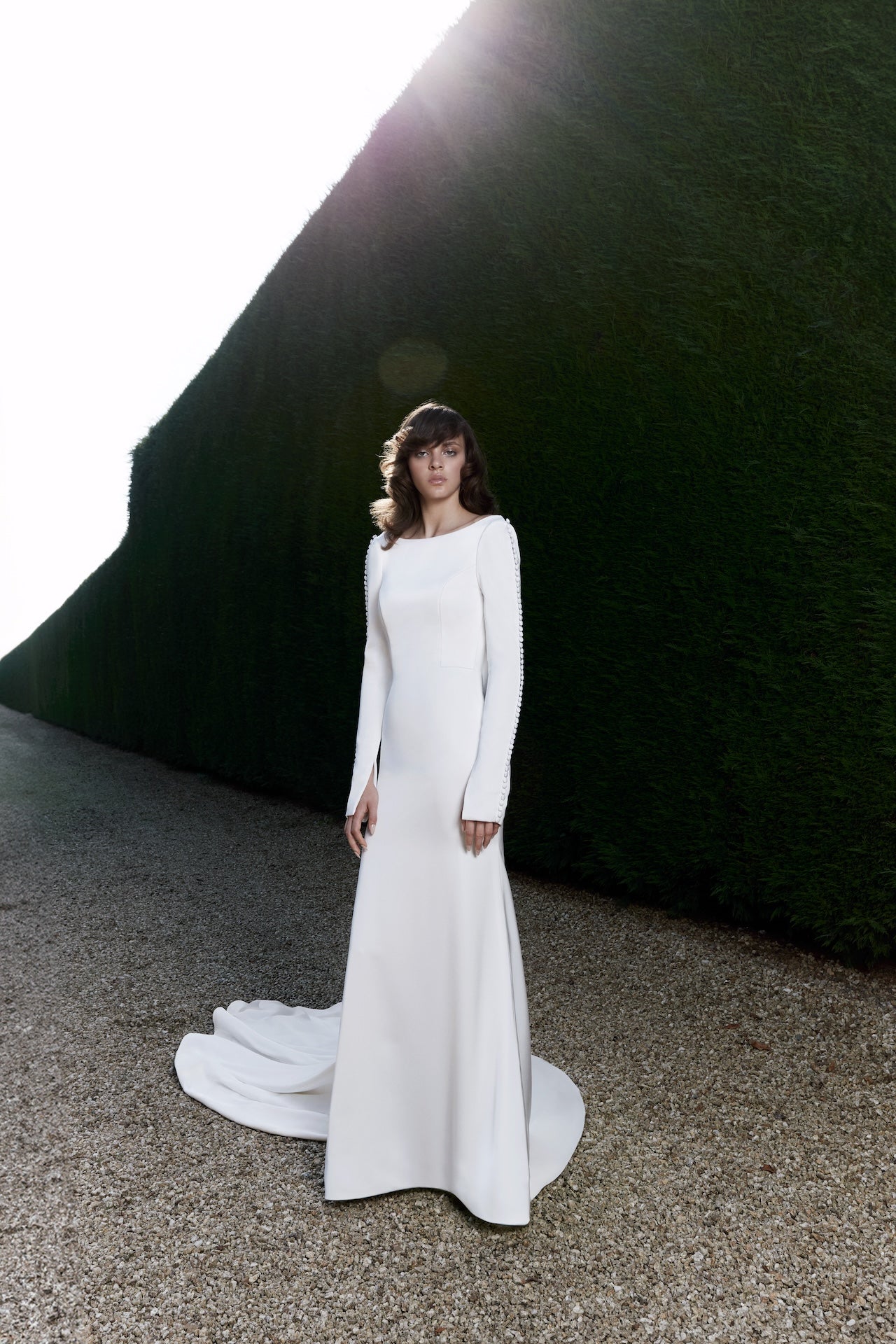 Viktor & Rolf Mariage Bridalwear, Autumn Winter 25 Collection, elegant white gown with long sleeves and modern tailoring.