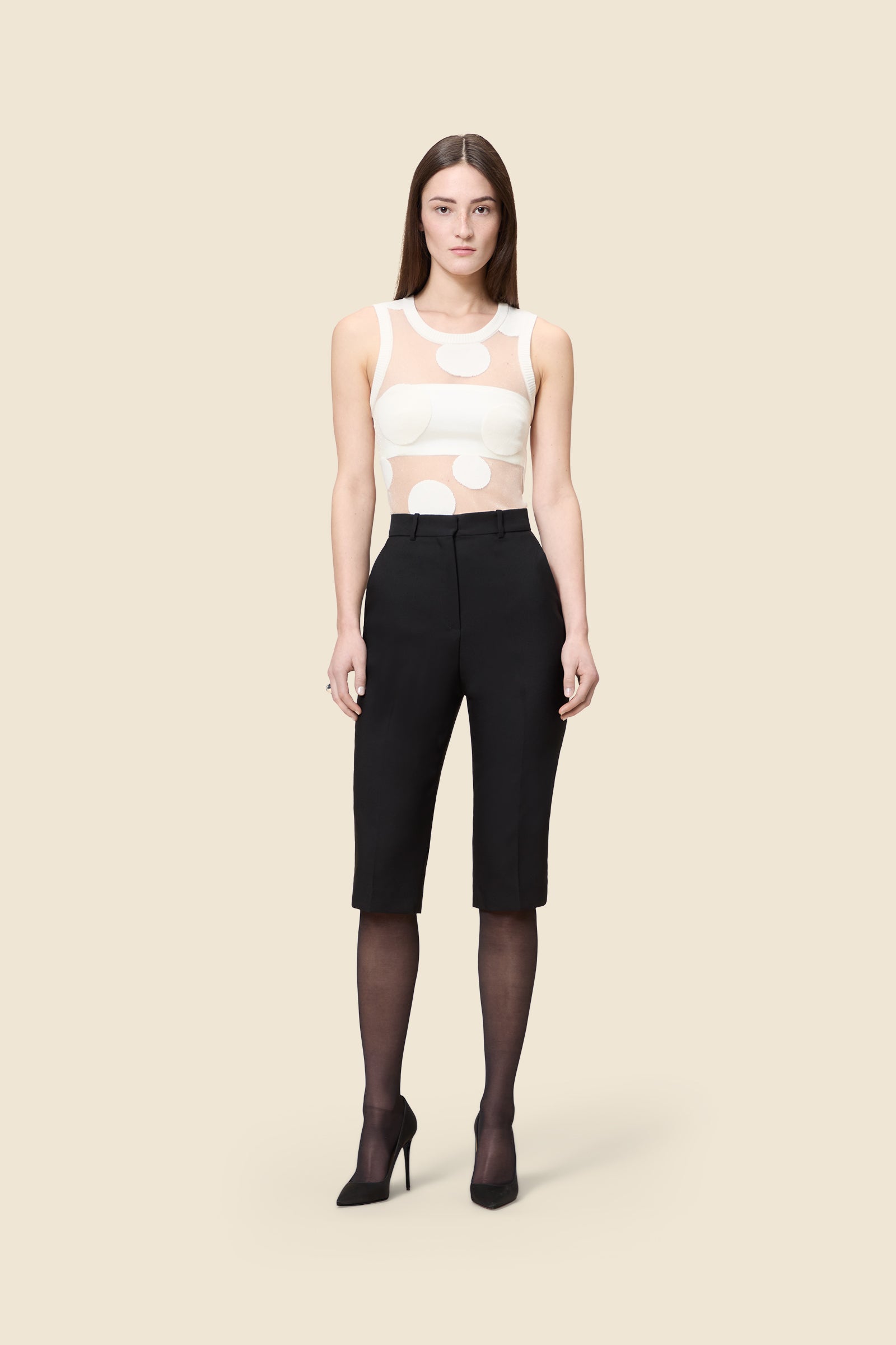 The classic pattern of the top is given a modern twist with intricate polka dot hole design on knit jacquard
