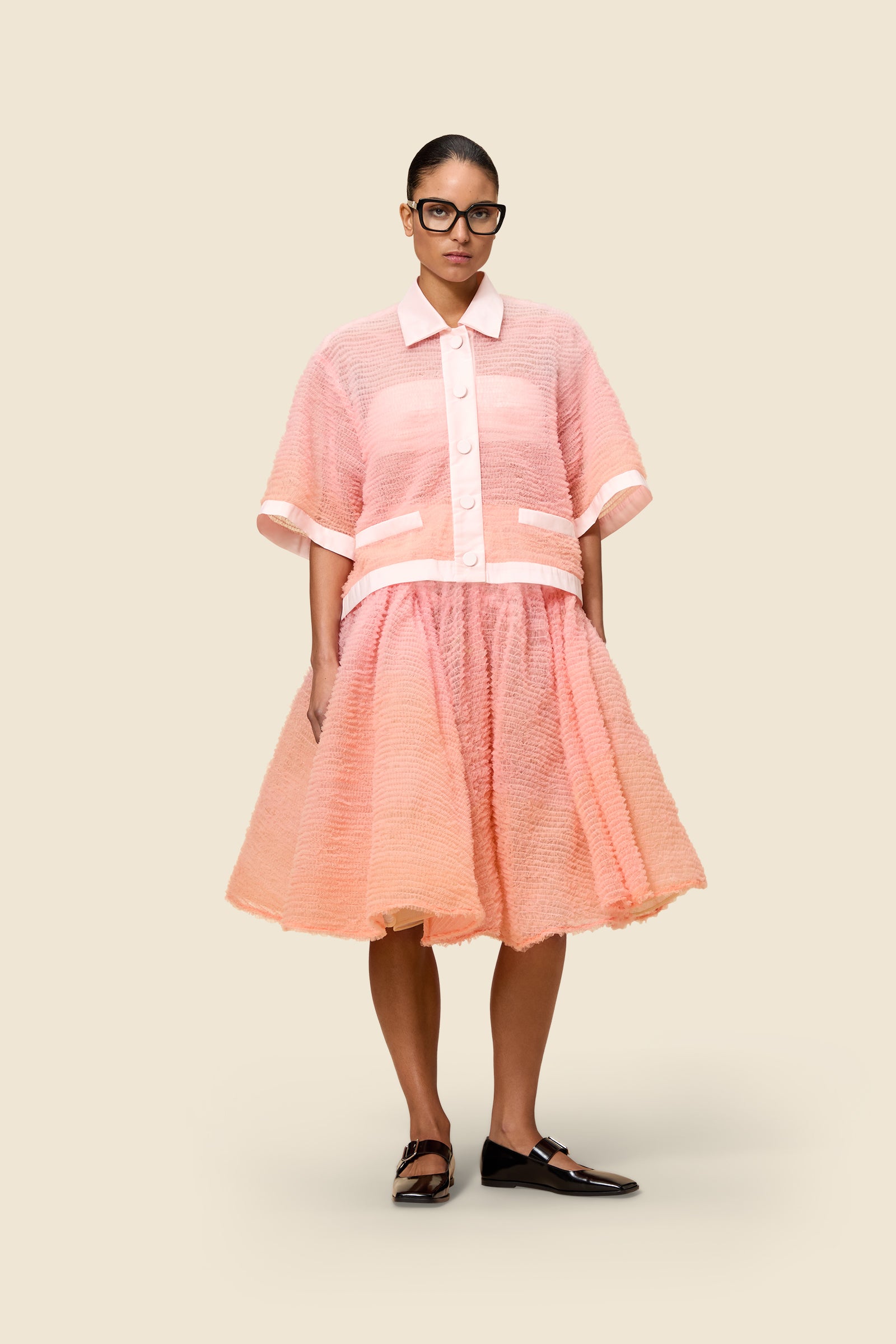 Inspired by the tulle from the ‘late stage capitalism waltz’ haute couture collection, the shirt features hand crafted tulle ruffles for a feminine texture